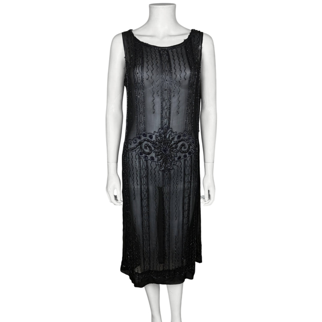 Authentic 1920s black silk chiffon flapper dress with Art Deco glass beadwork and dropped waist, front view