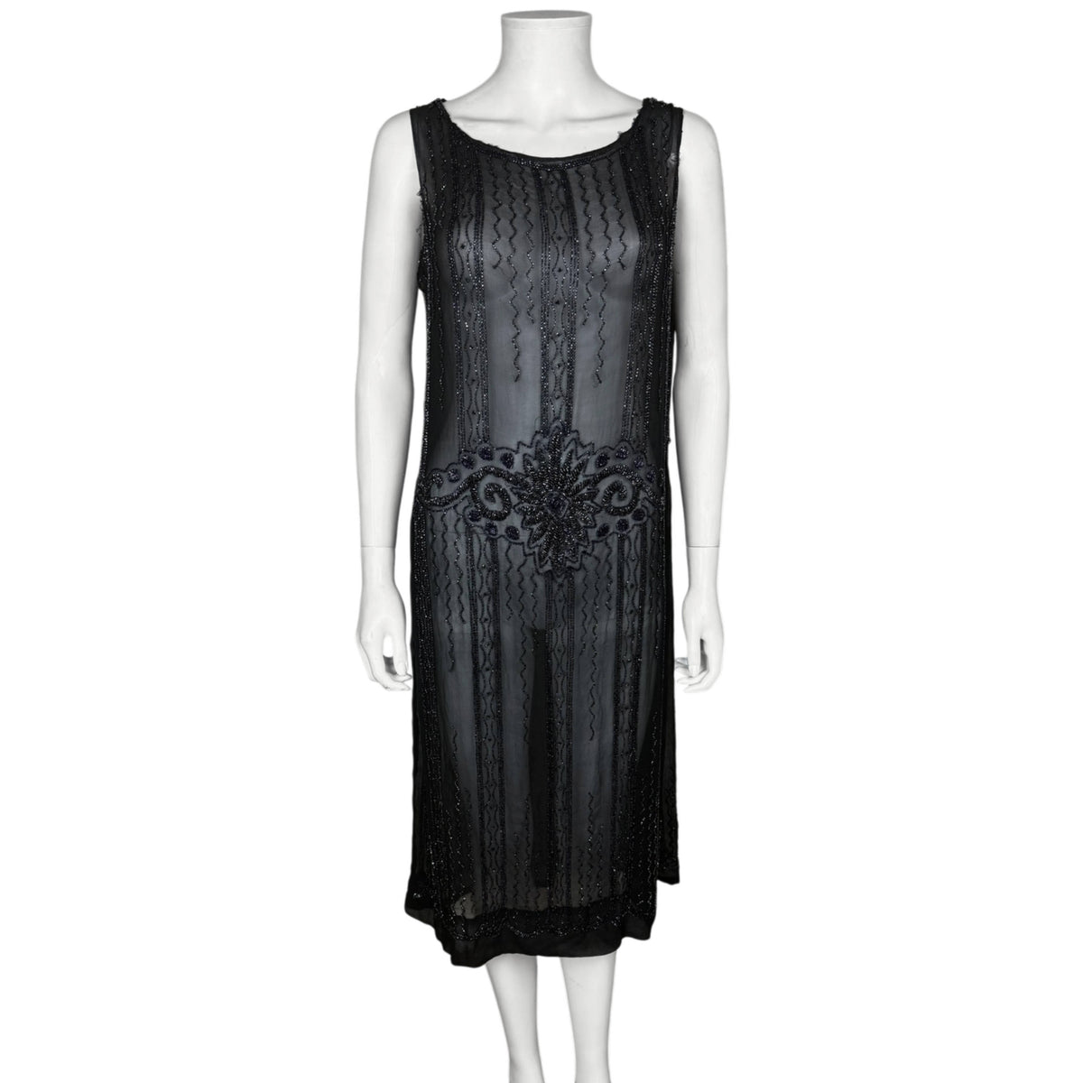 Authentic 1920s black silk chiffon flapper dress with Art Deco glass beadwork and dropped waist, front view