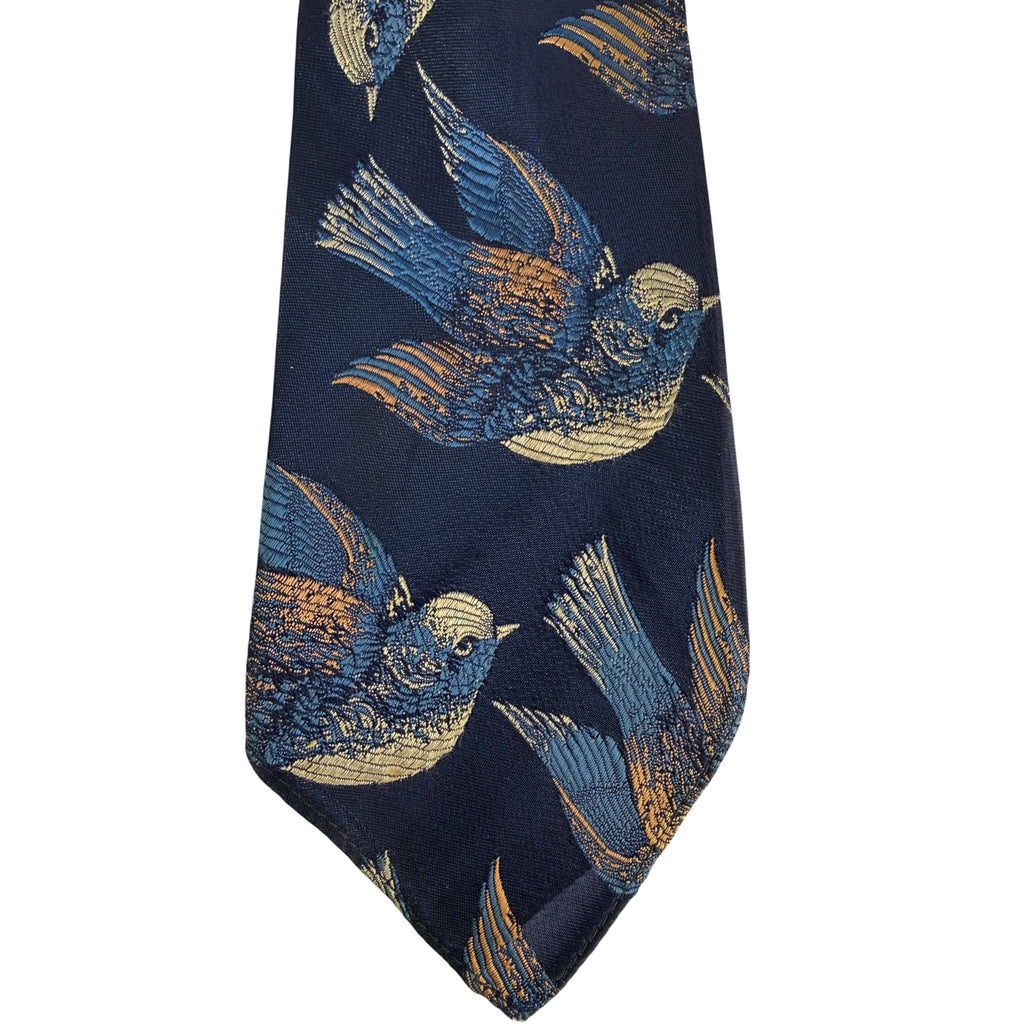Close-up of woven blue and gold bird jacquard design
