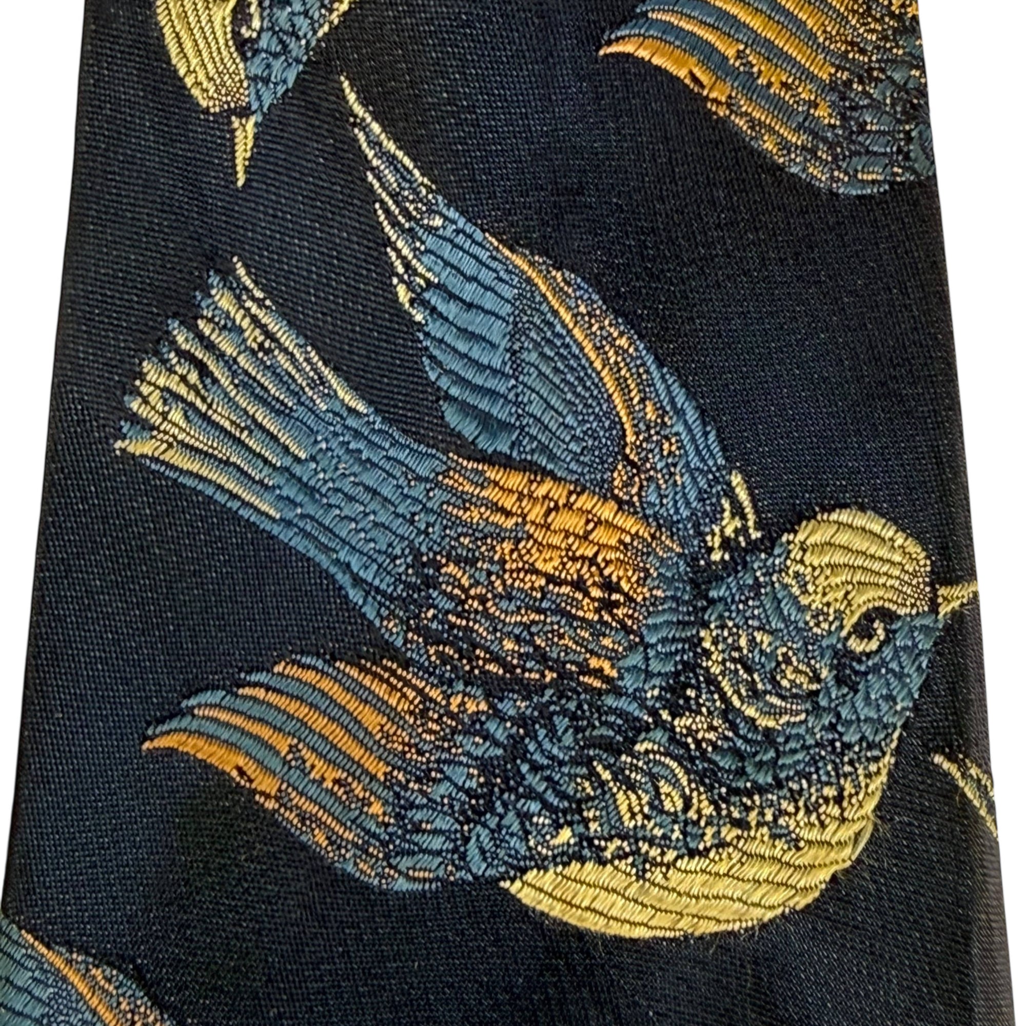 Detail of woven blue and gold bird jacquard design