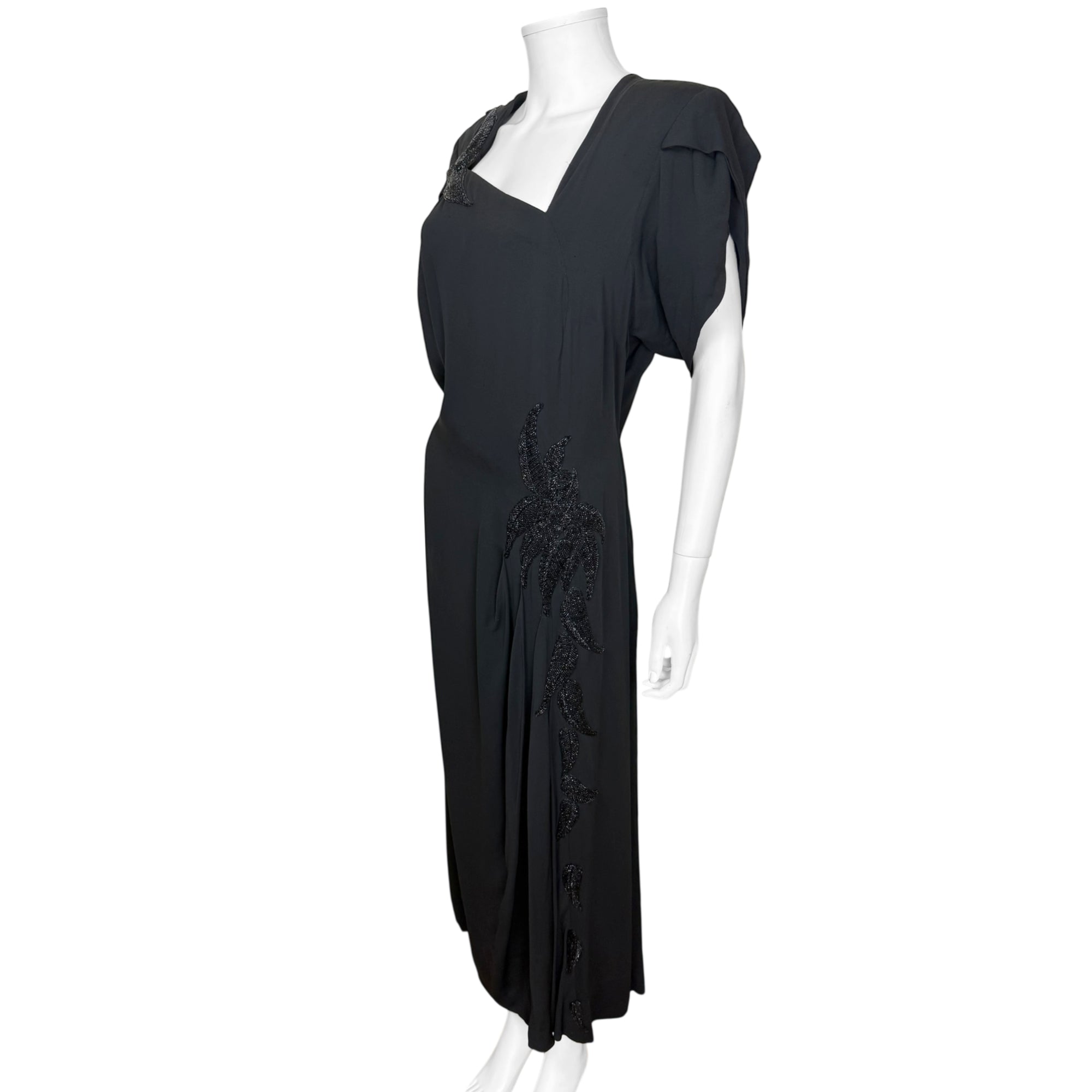 Vintage 1940s black evening gown with cascading beadwork
