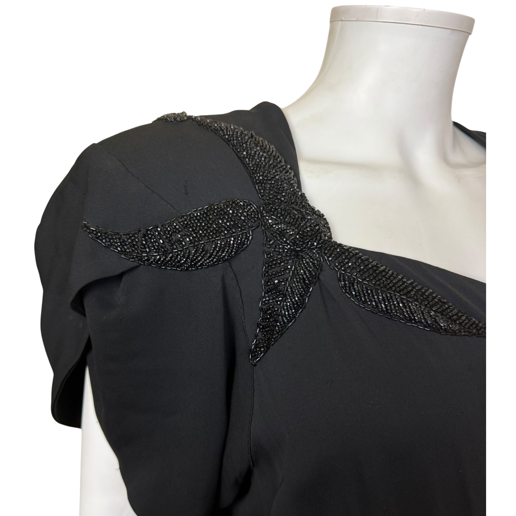 Close-up of black bead shoulder detail