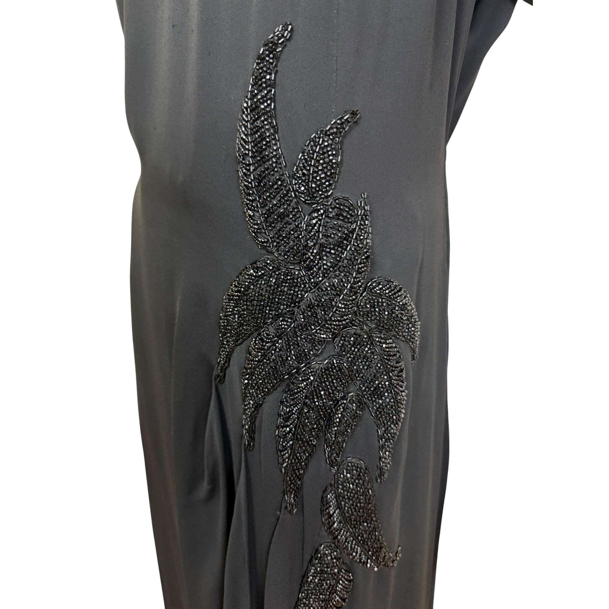 close up on beading on side of 40s dress