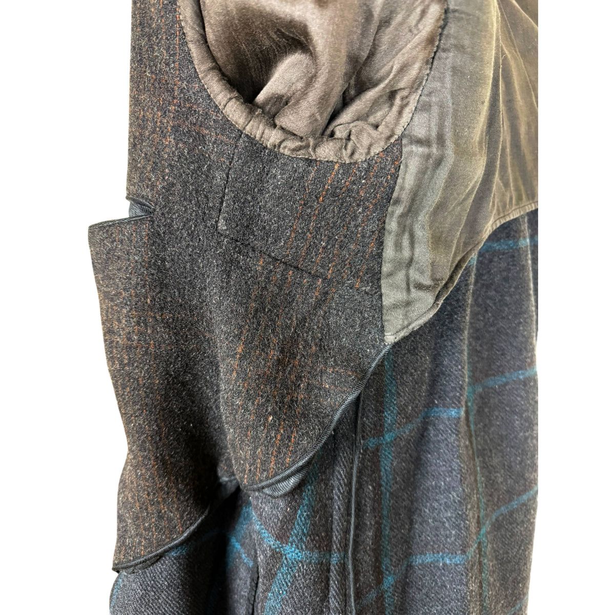 close-up of detail of construction to interior of 1930s men's overcoat