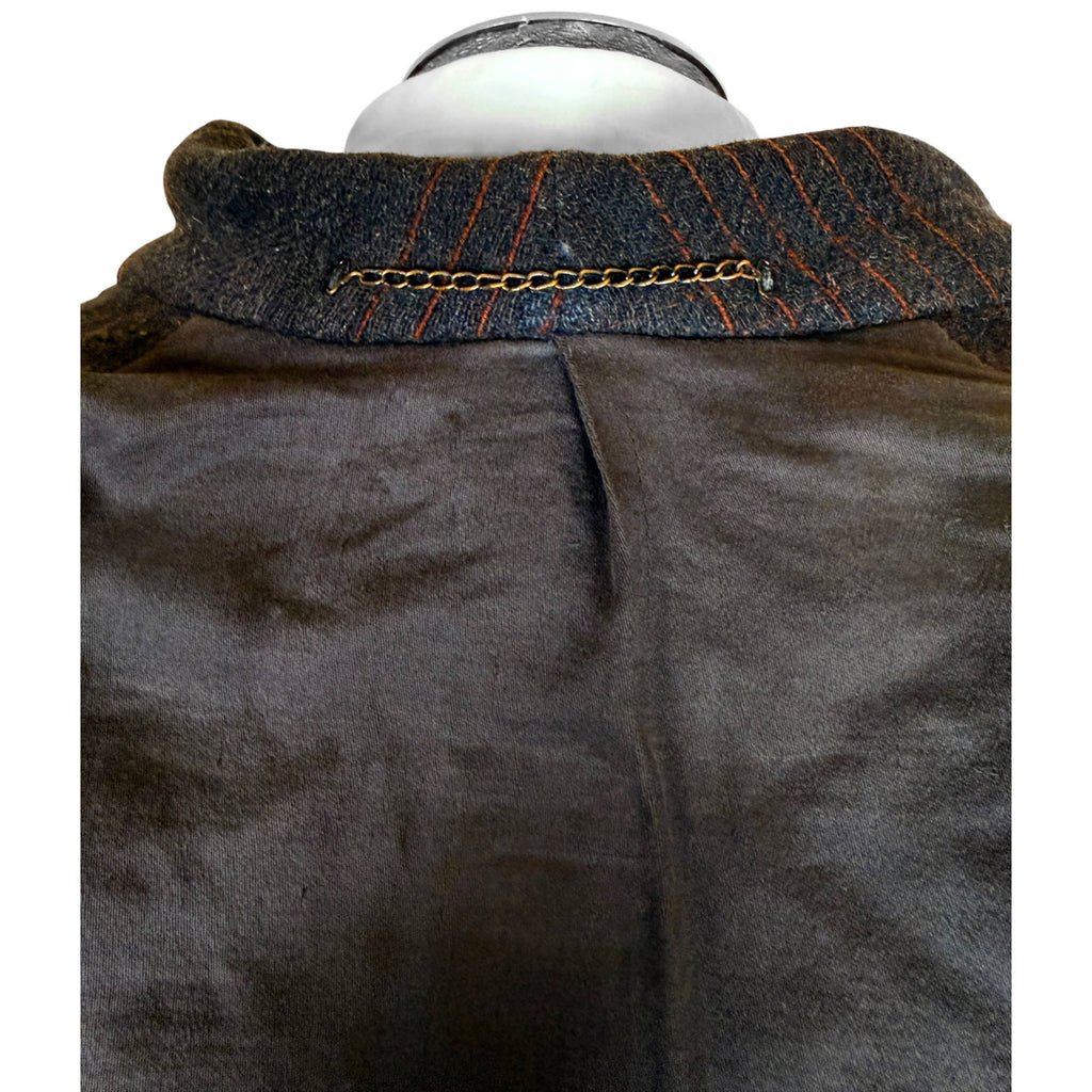 Close-up of interior collar and metal chain hanging loop on vintage 1930s men's wool overcoat