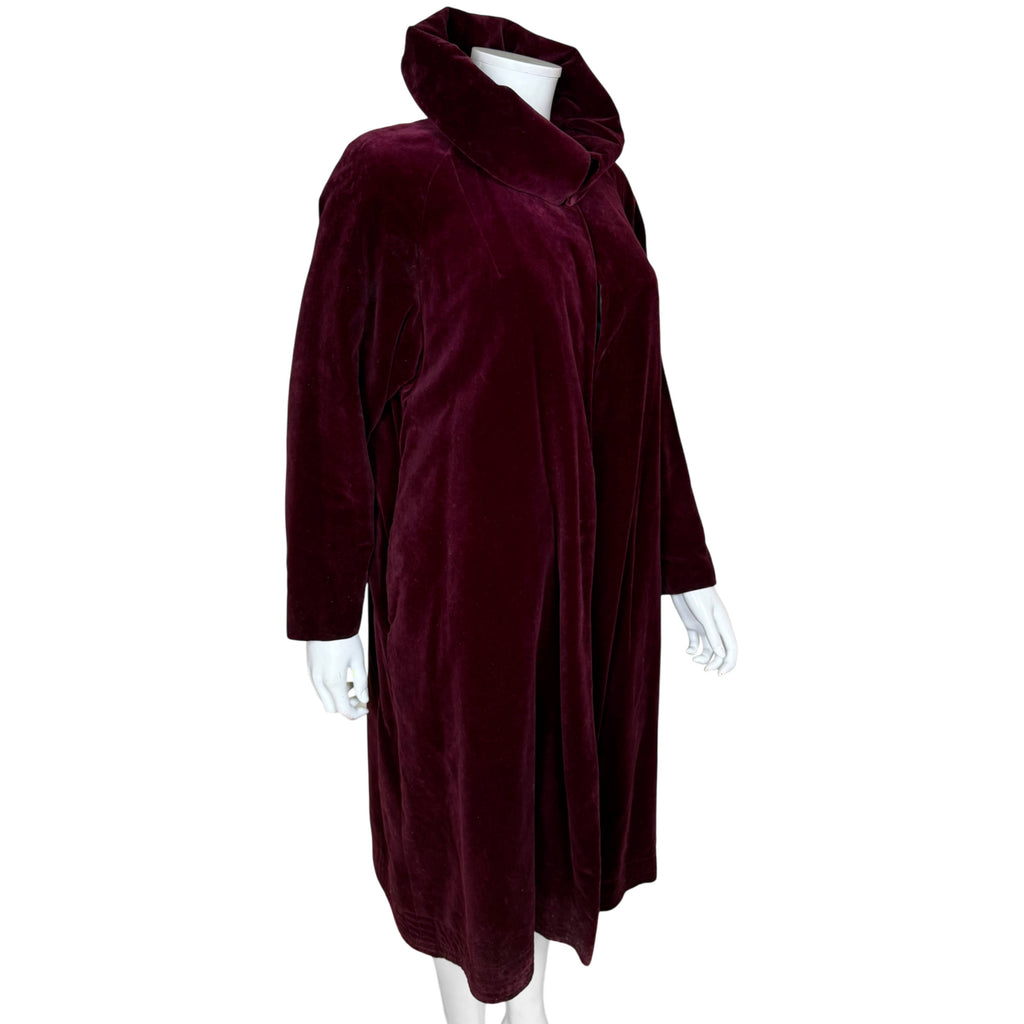 Vintage burgundy velvet evening coat three-quarter view showing flowing silhouette and raised collar