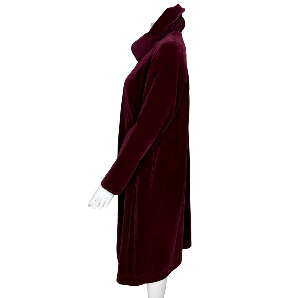 Side view of 1950s burgundy velvet evening coat with long raglan sleeves and flared shape