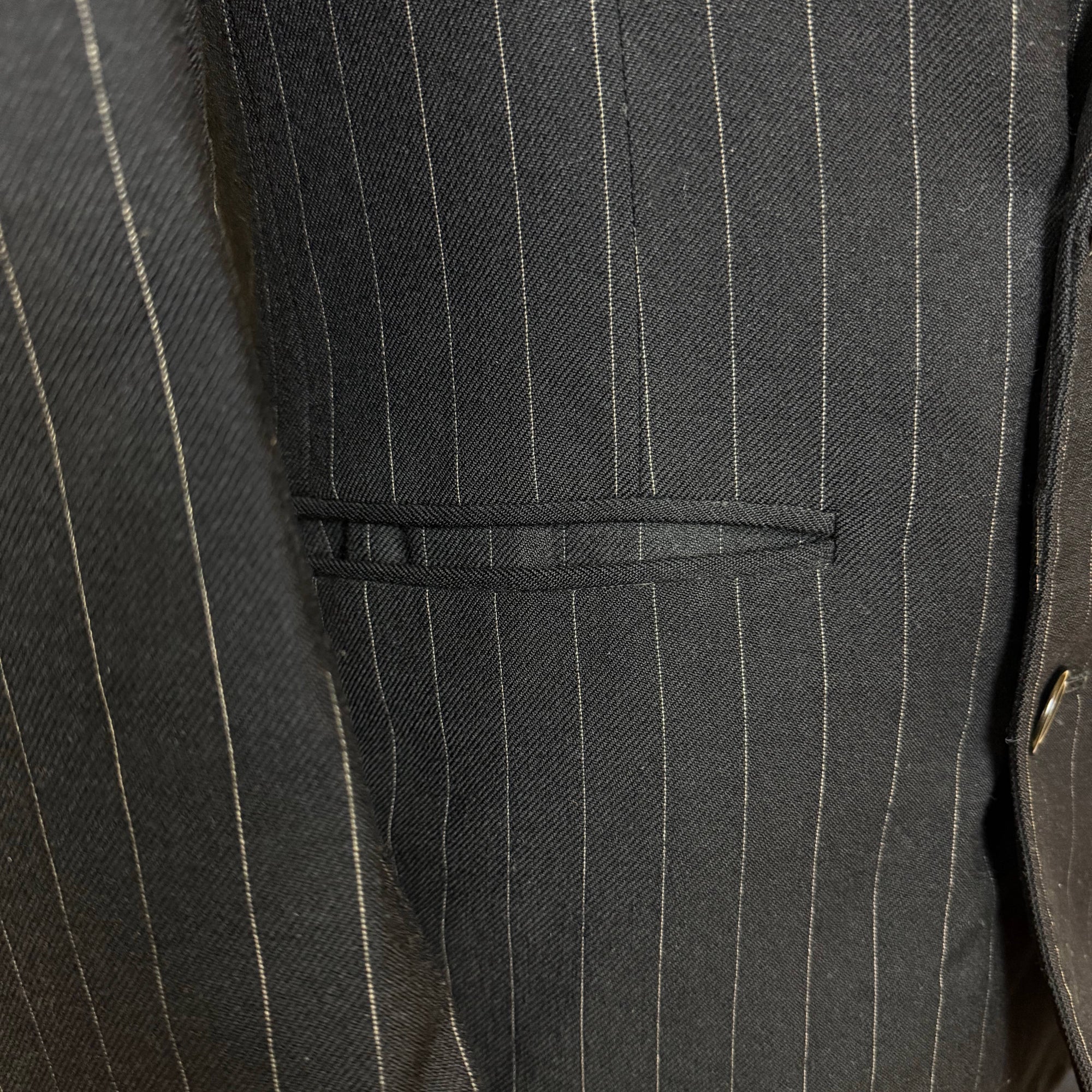 Jetted hip pocket and fine pinstripe fabric on 1951 suit jacket