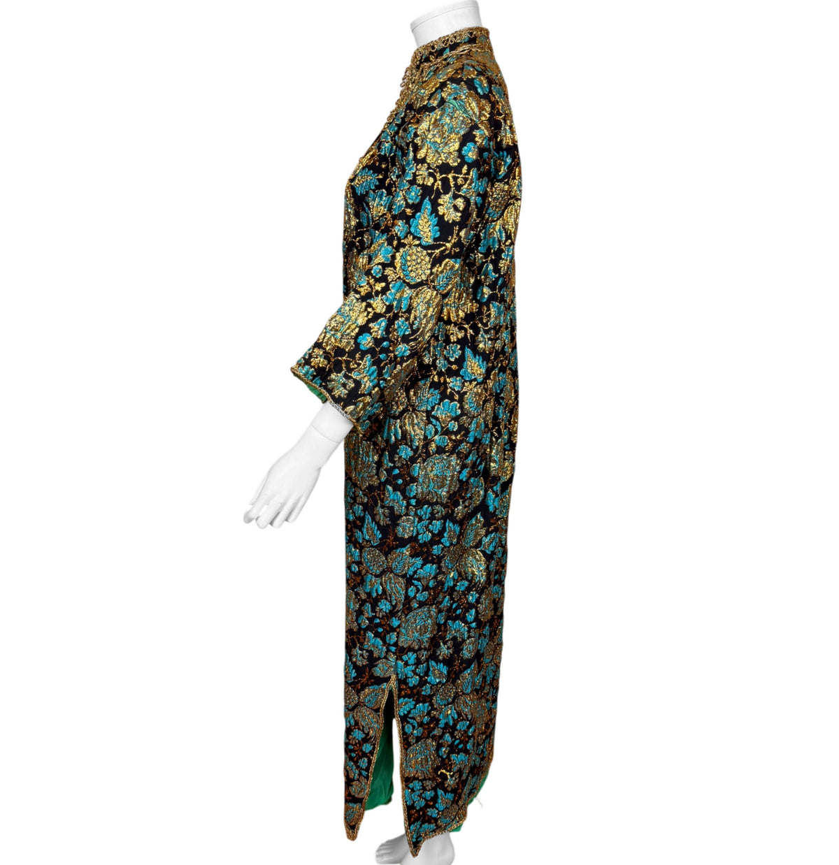 Side view of 1960s Moroccan brocade kaftan showing three-quarter sleeve and lower side slit with green lining