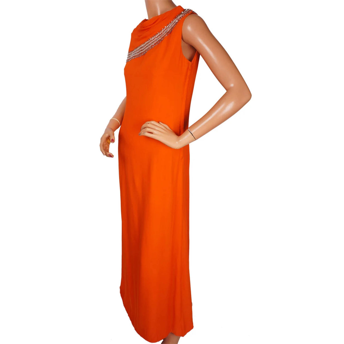 A bright orange sleeveless maxi dress with a draped neckline and silver beaded trim, displayed on a female mannequin against a plain white background.