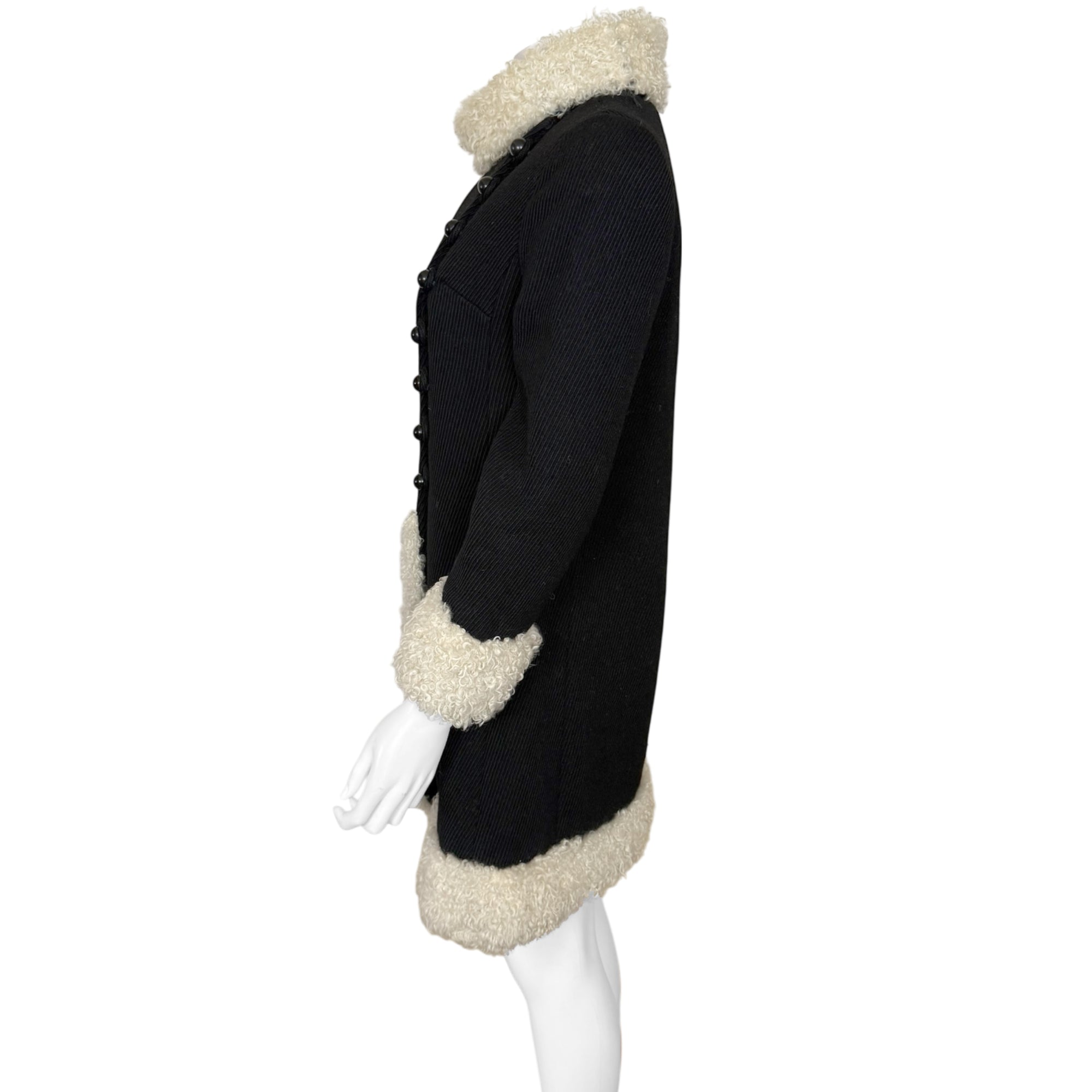 Side view of 1960s black wool coat with mouton trim 