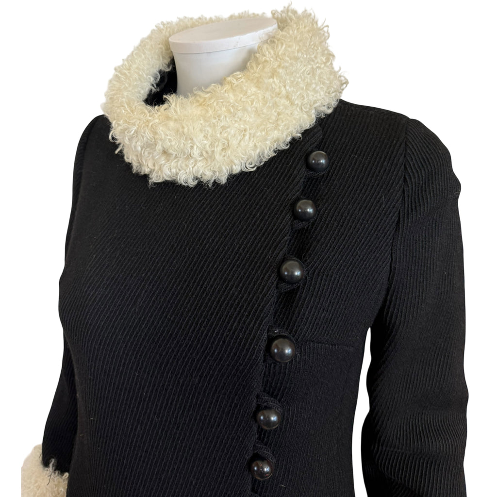 Close up detail of 1960s black wool coat mouton trim front