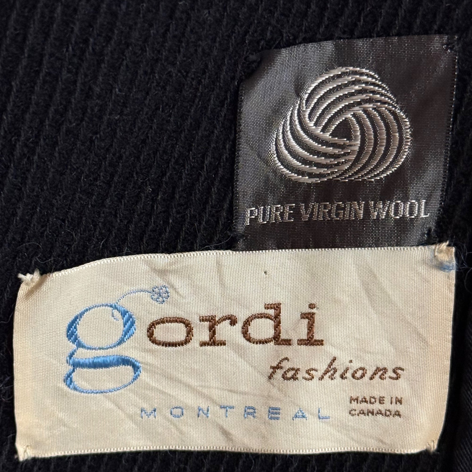 Gordi Fashions montreal label on 1960s black wool coat with mouton trim front