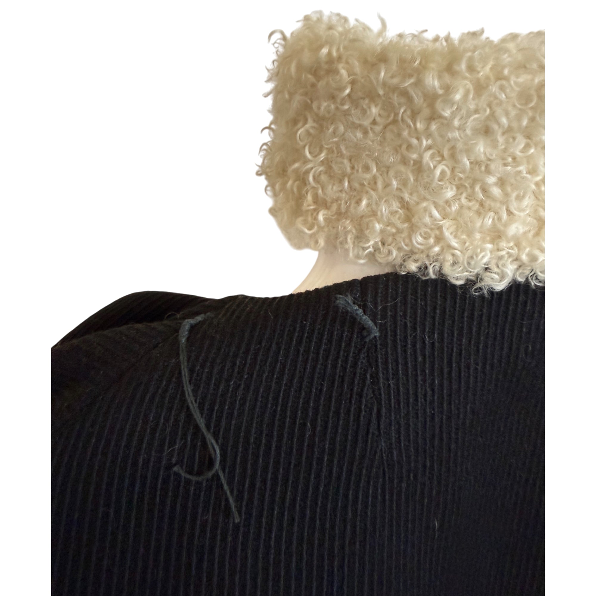 detail of mouton collar detached from coat