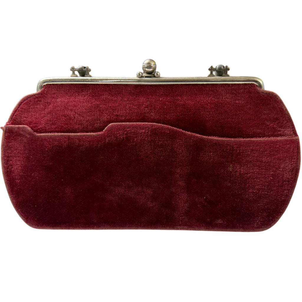 Back of Edwardian burgundy velvet handbag showing large exterior pocket with shaped upper edge