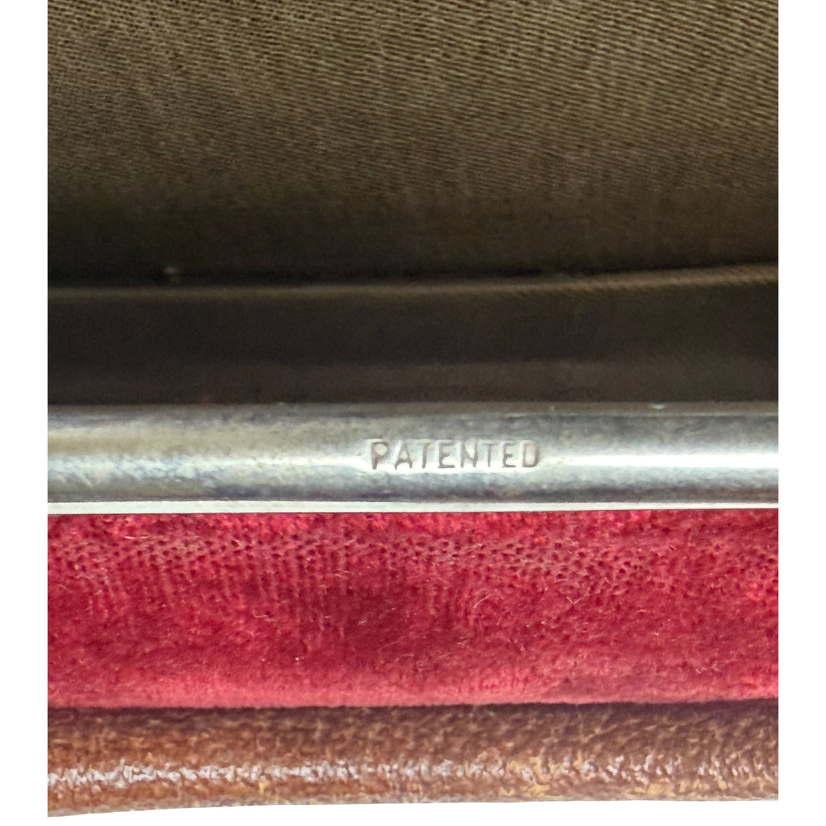 PATENTED marking stamped on silver-coloured metal frame of antique Edwardian velvet handbag