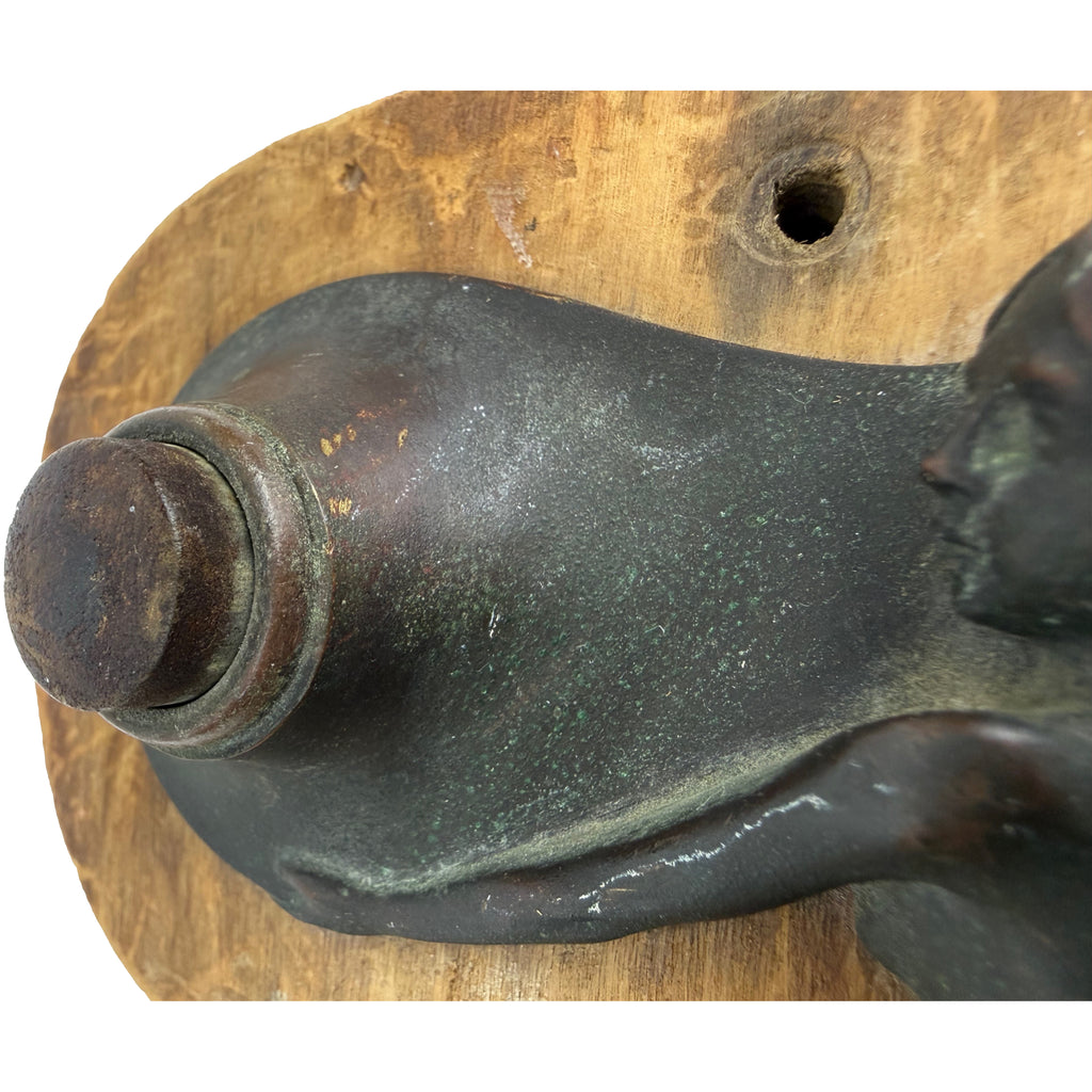 Patinated bronze female figure with circular servant-call button