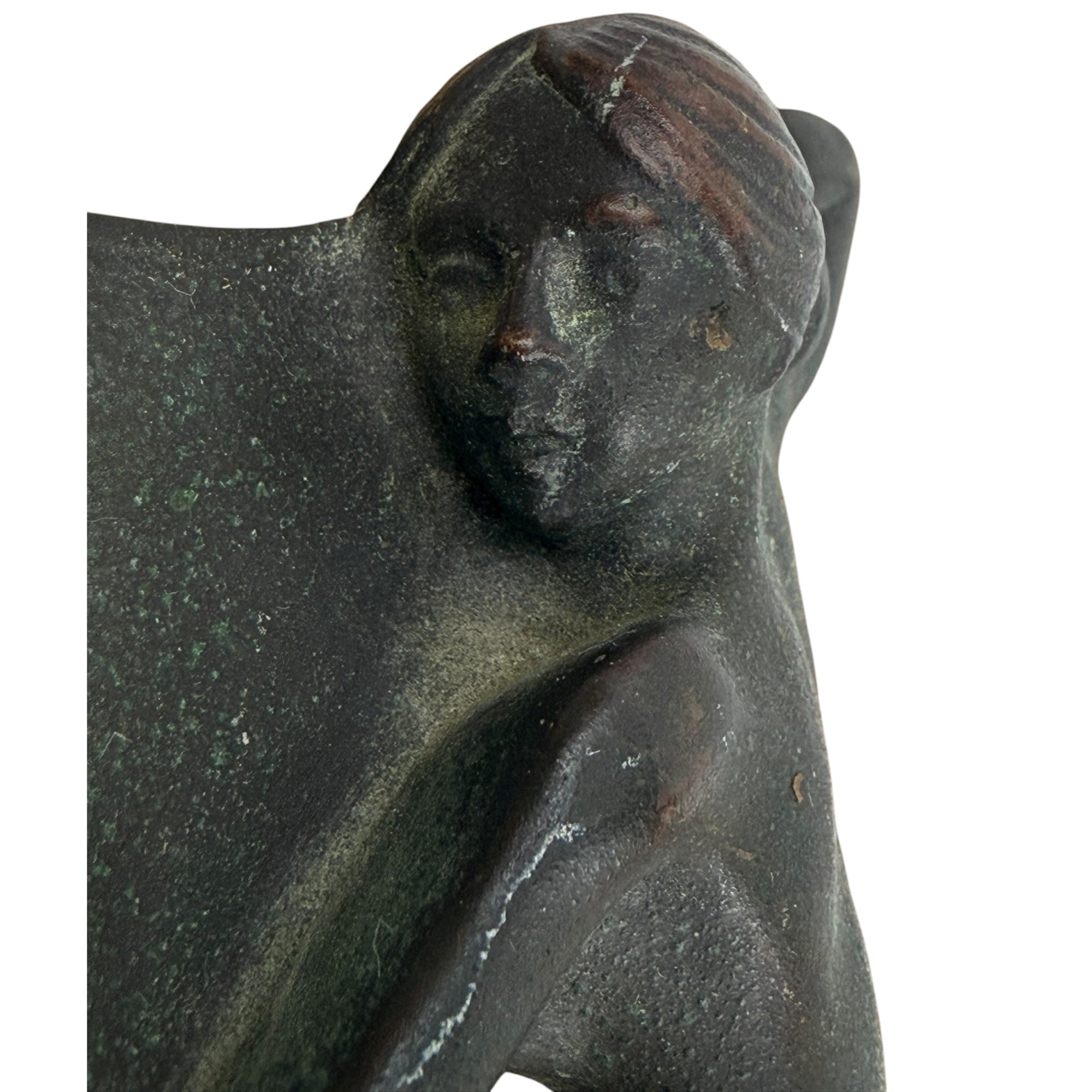 Close-up of Art Nouveau bronze nude woman’s face and patina