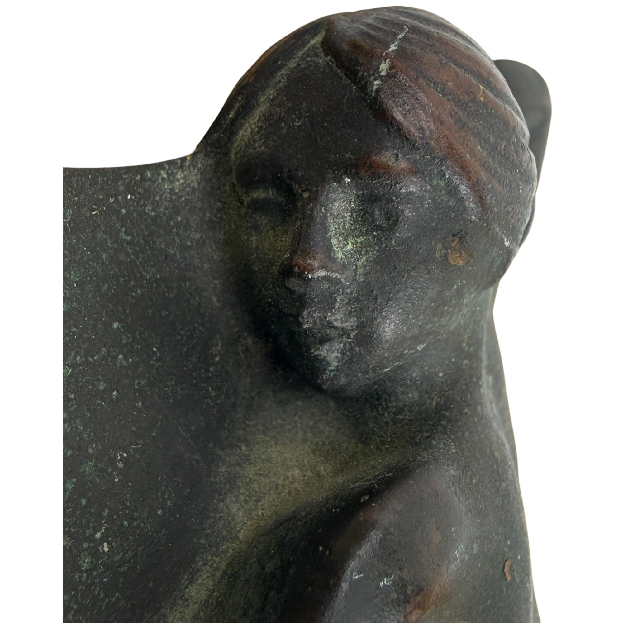 Close-up of  bronze nude woman’s face 