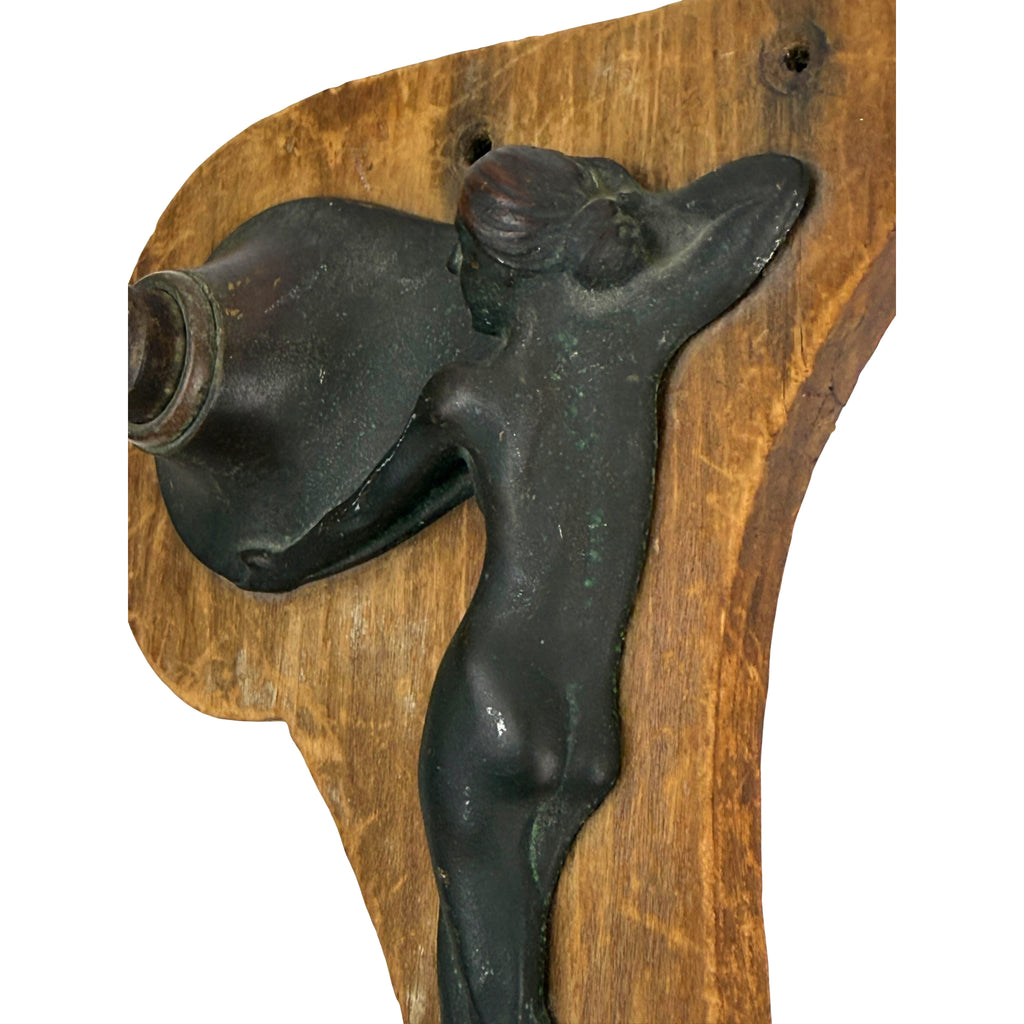 Elongated female figure forming an Art Nouveau bell push design
