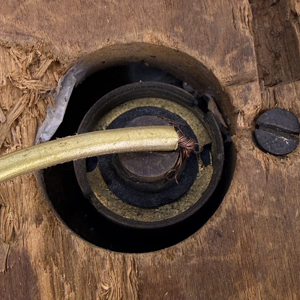 Close-up of antique electrical push-button mechanism