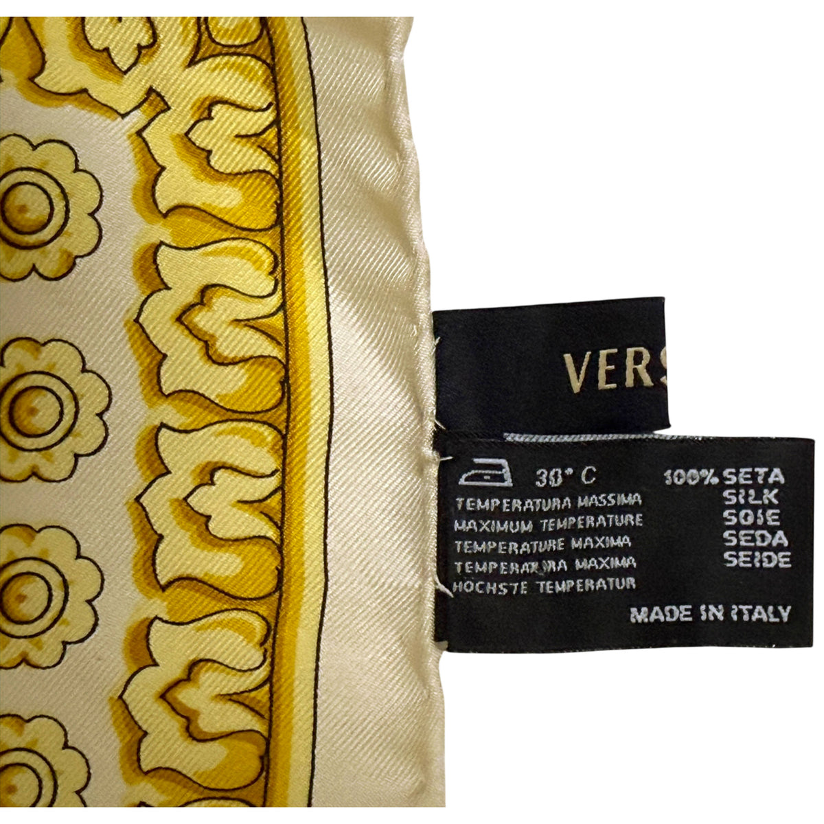 Original Versace label and 100% silk Made in Italy fabric content label on vintage scarf