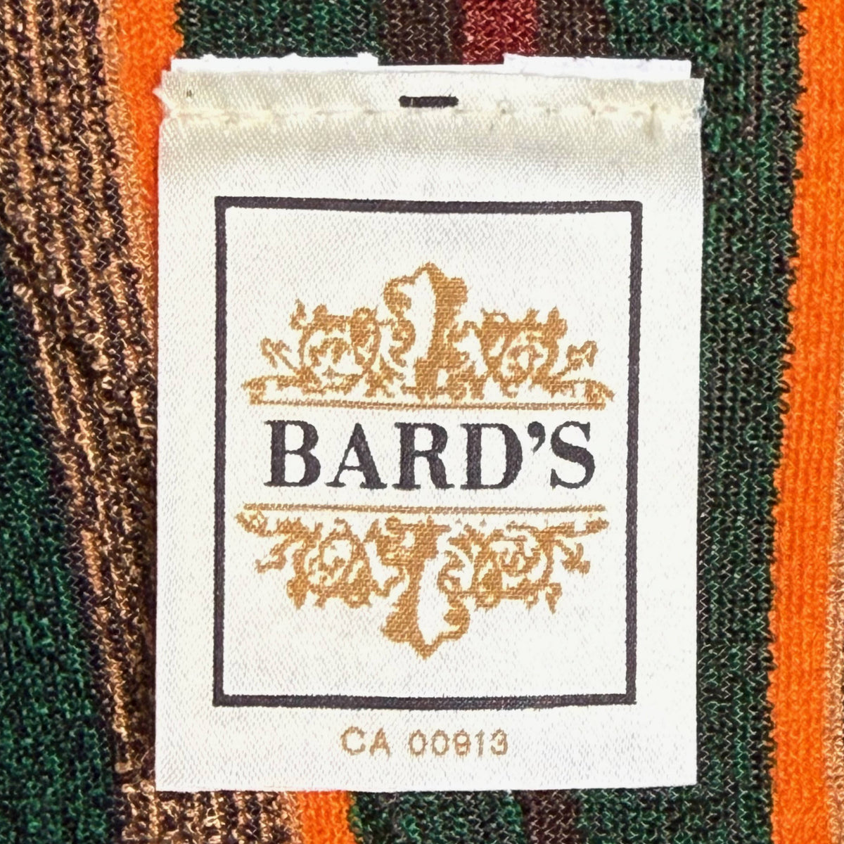 Original Bard's Canadian clothing label with decorative gold crest and CA 00913 identification number