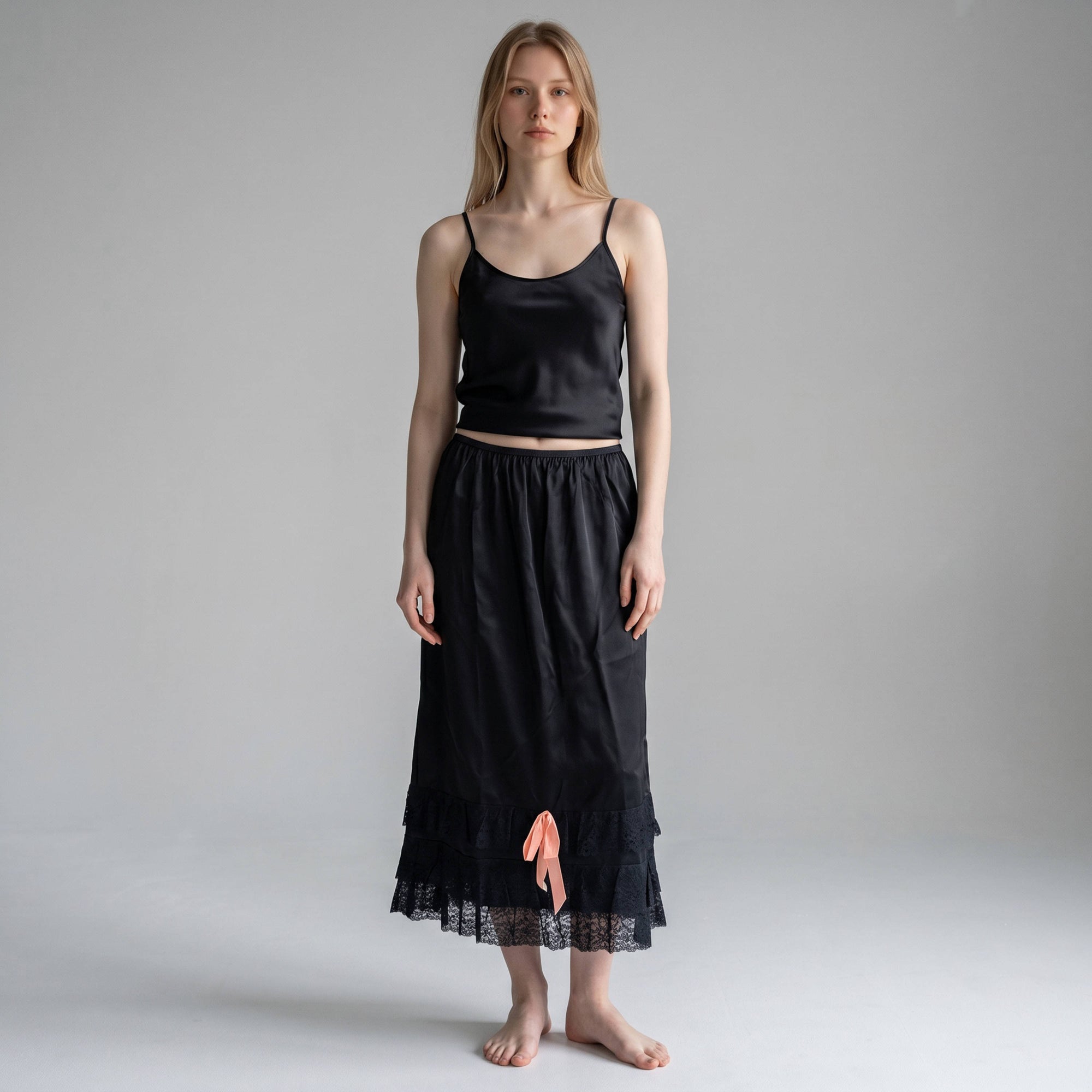 AI model wearing vintage 1940s Black Taffeta Half Slip with Lace Trim & Pink Satin Bow 