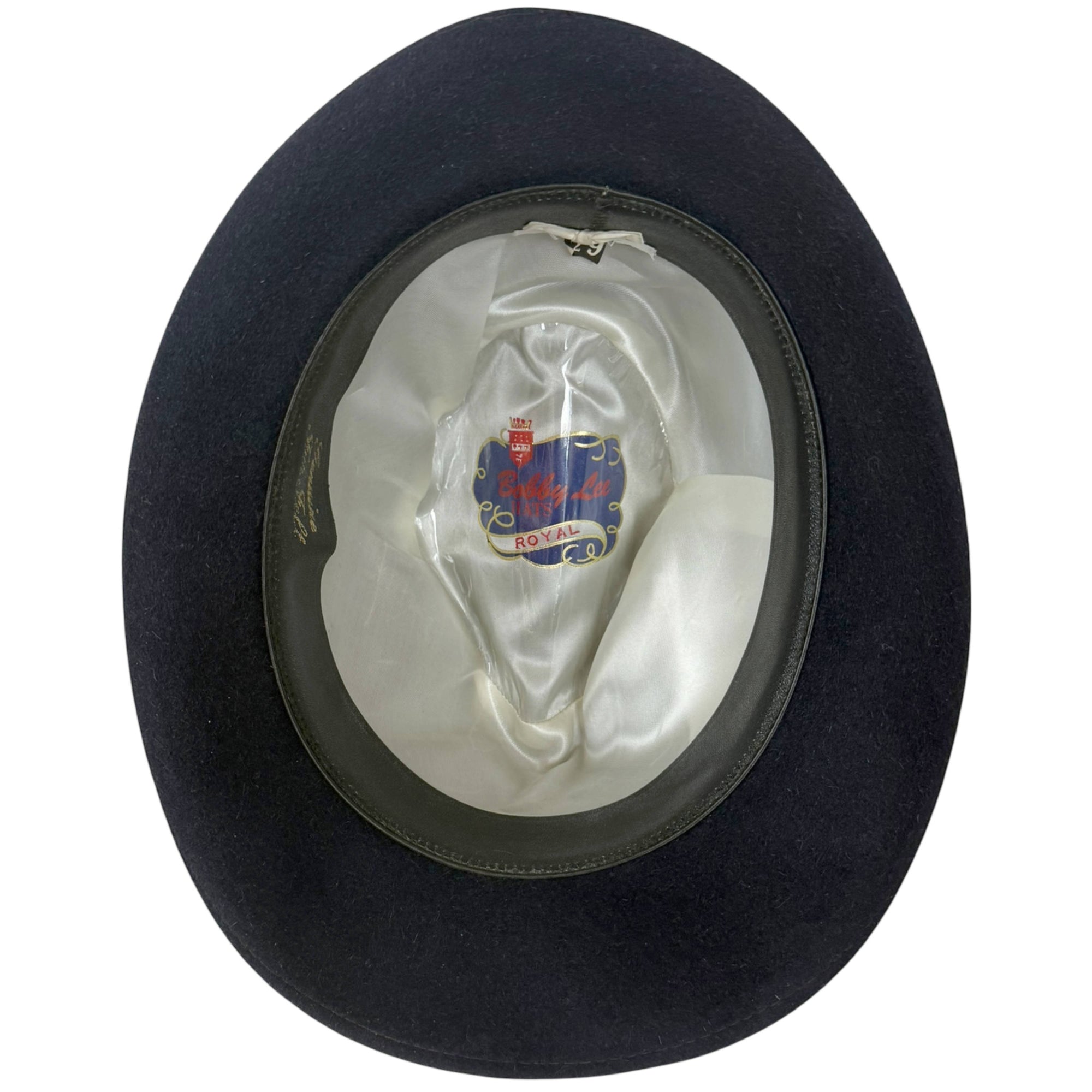 Interior of vintage Bobby Lee Royal fedora showing satin lining and crest under celluloid
