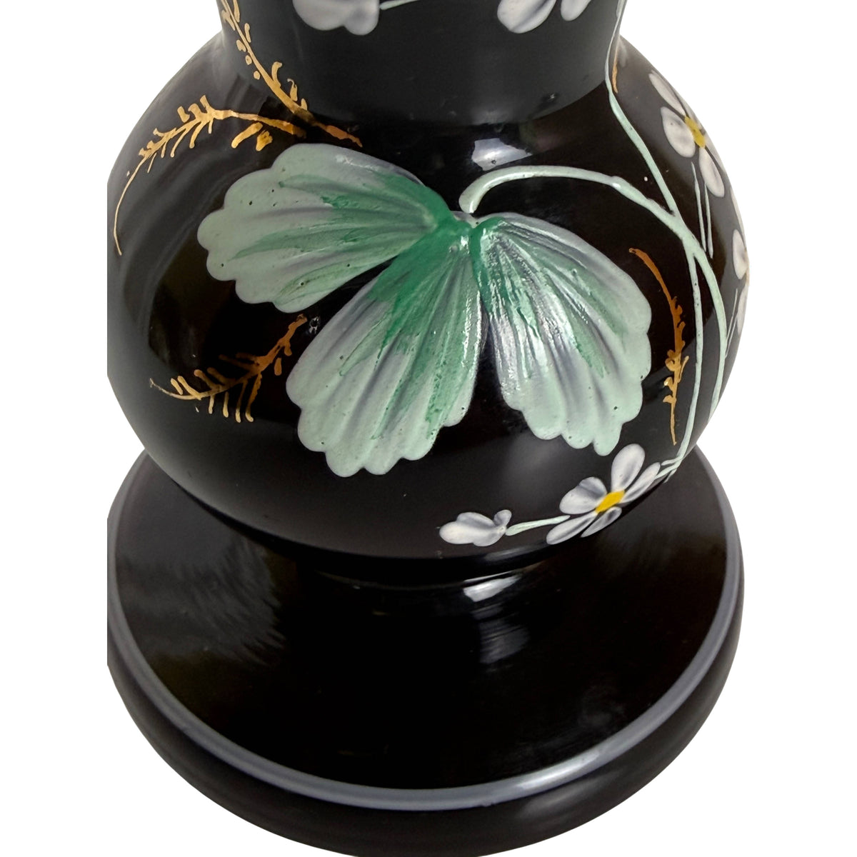 Close-up of hand enamelled flowers and gilt foliage on Bohemian glass vase