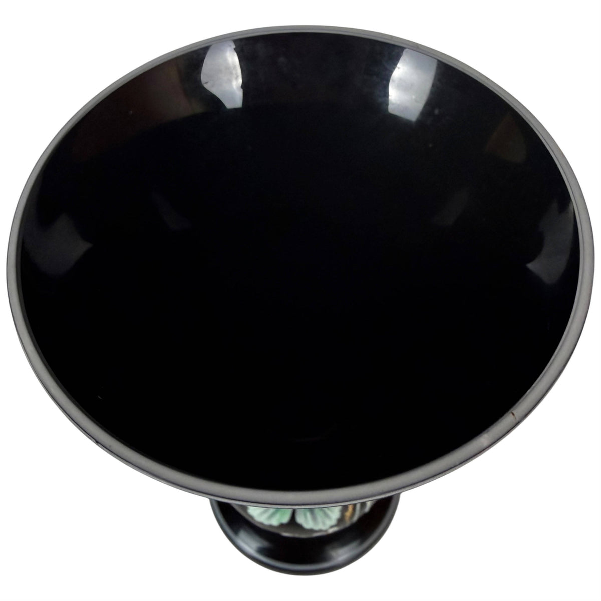 Top view of antique black amethyst cased glass vase with white interior