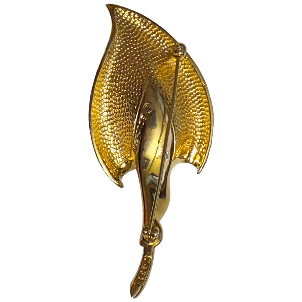 Reverse of vintage Marcel Boucher calla lily brooch showing textured gold-plated metal and pin clasp