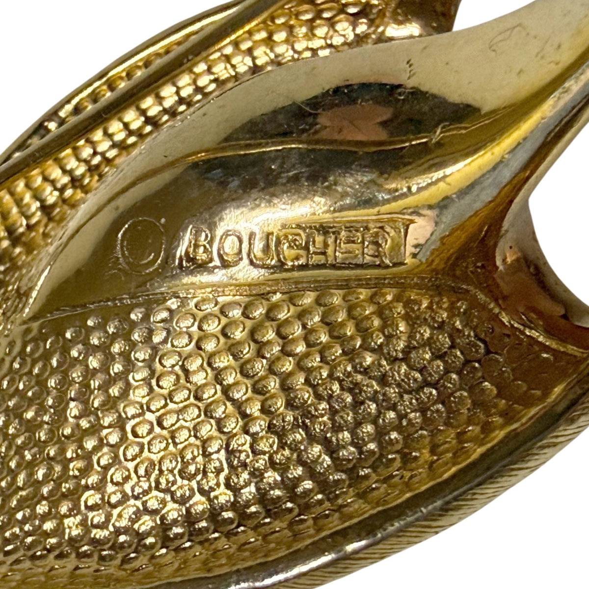 Close-up of signed copyright BOUCHER hallmark on reverse of vintage 1950s floral brooch