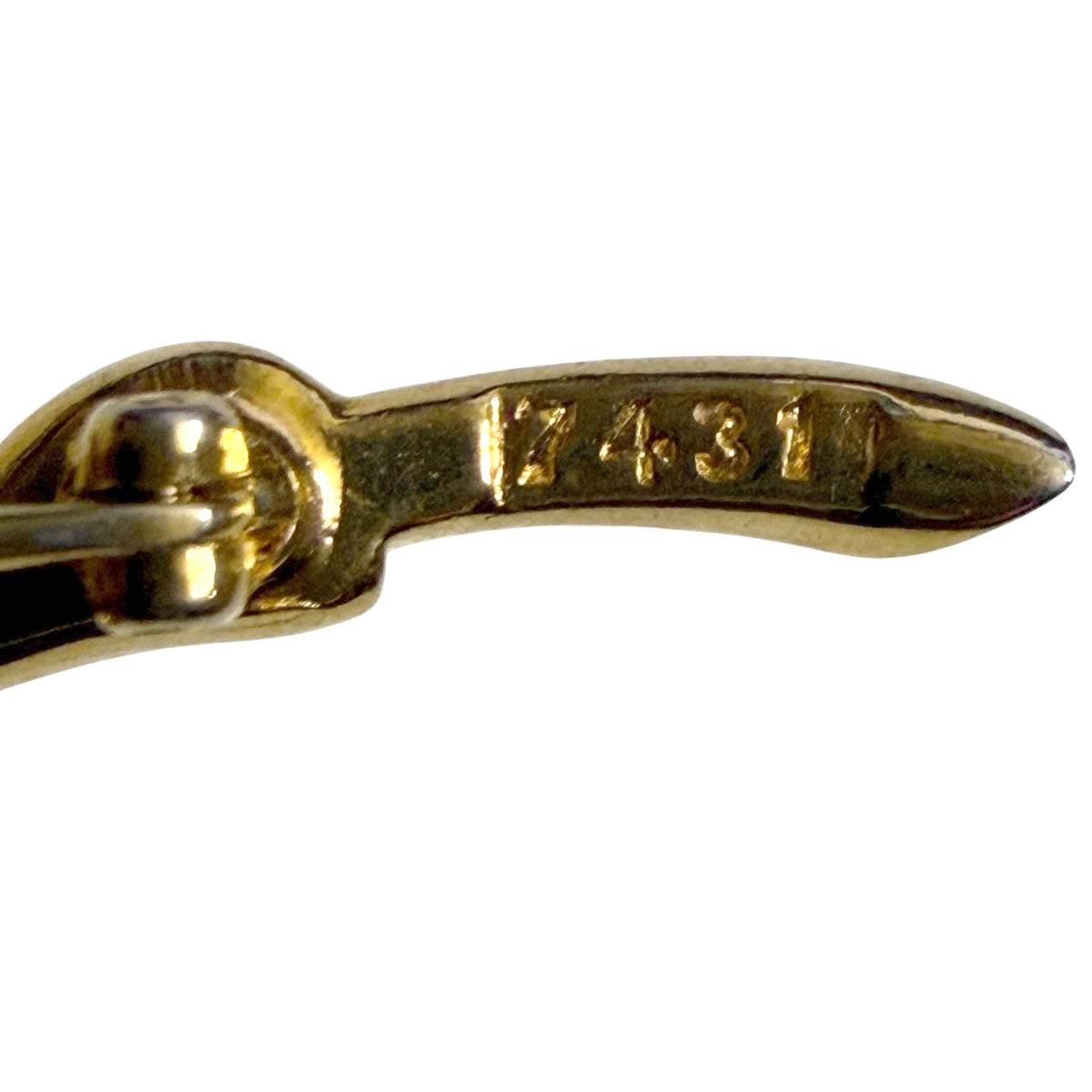 Close-up of Marcel Boucher design number 7431 stamped on the brooch pin stem