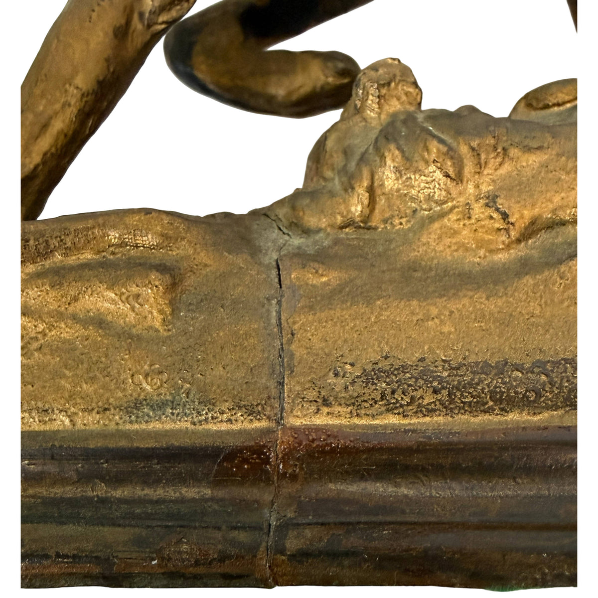 Crack in base of antique bronzed spelter dog sculpture