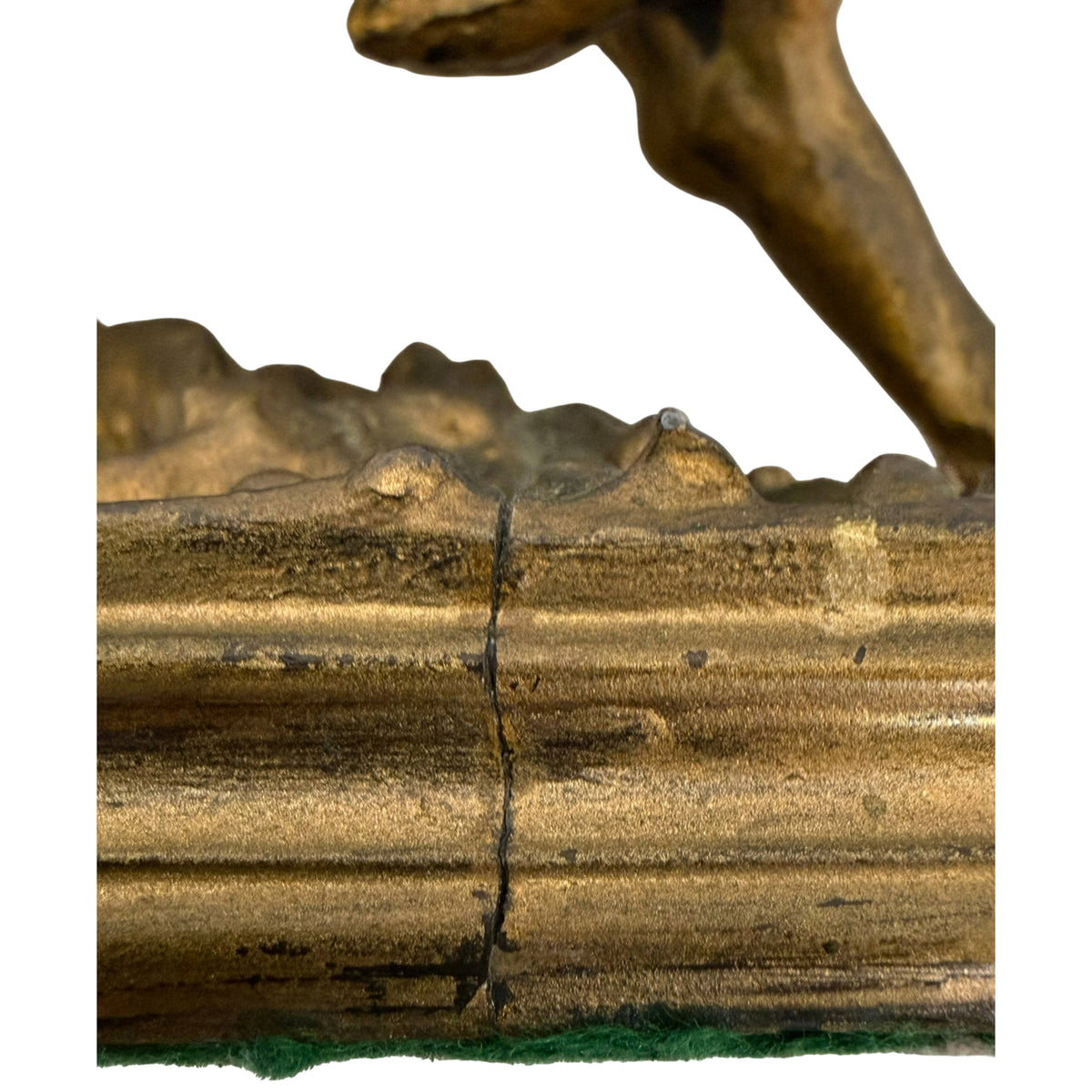Detail of crack and aged finish on spelter sculpture base