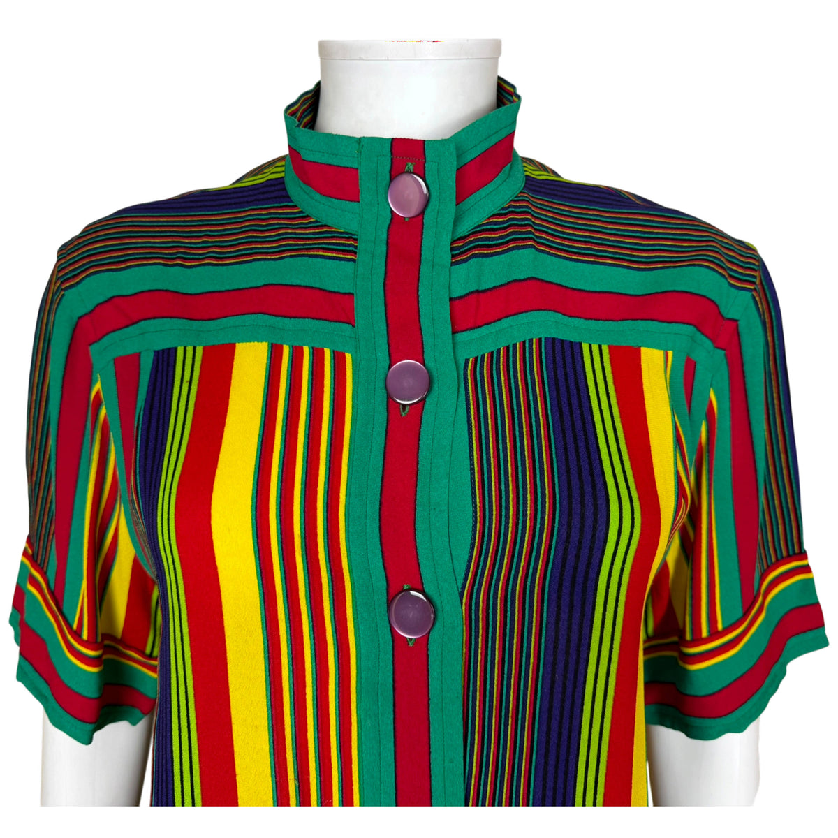 Close-up of Céline Paris dress showing Mandarin-style collar, eight-button front and contrasting striped yoke