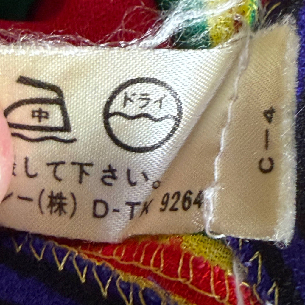 Close-up of additional Japanese garment care and distributor markings on vintage Céline dress