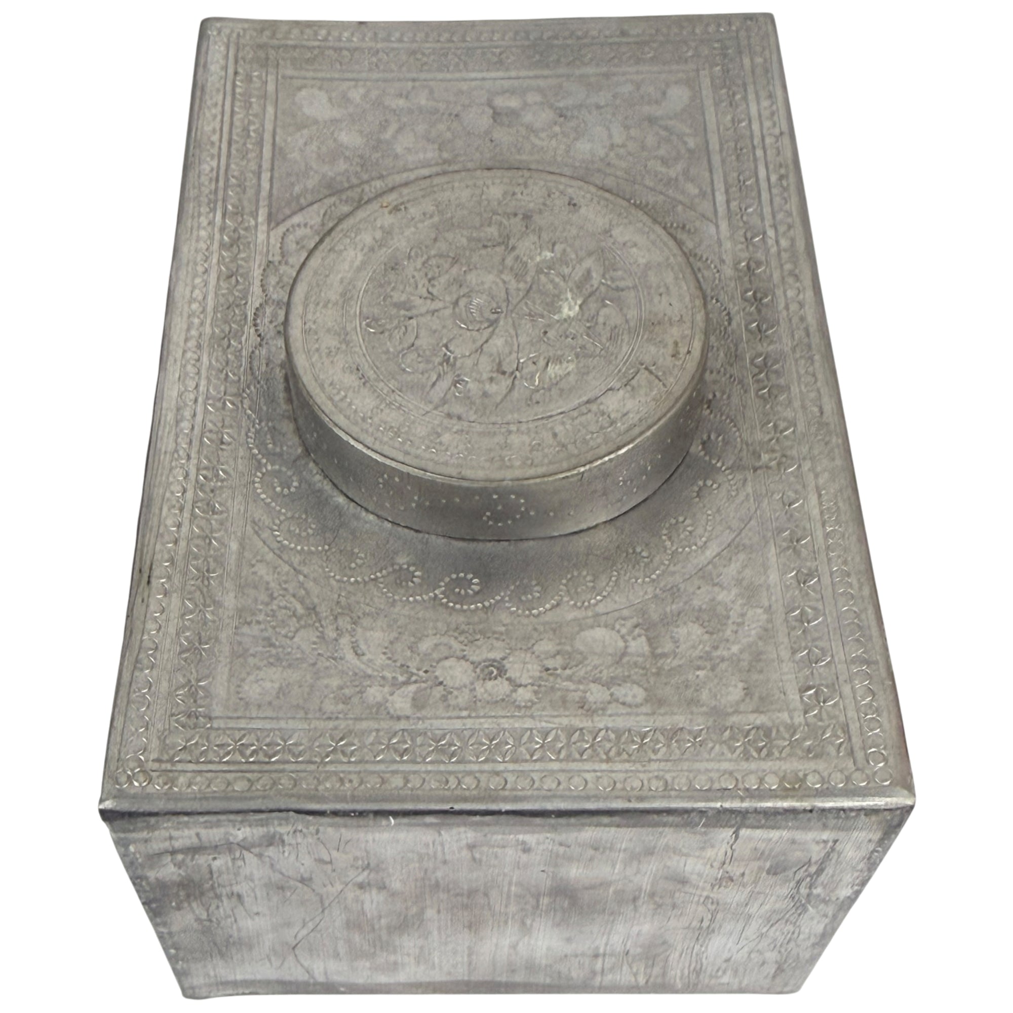 close up of antique metal tea canister