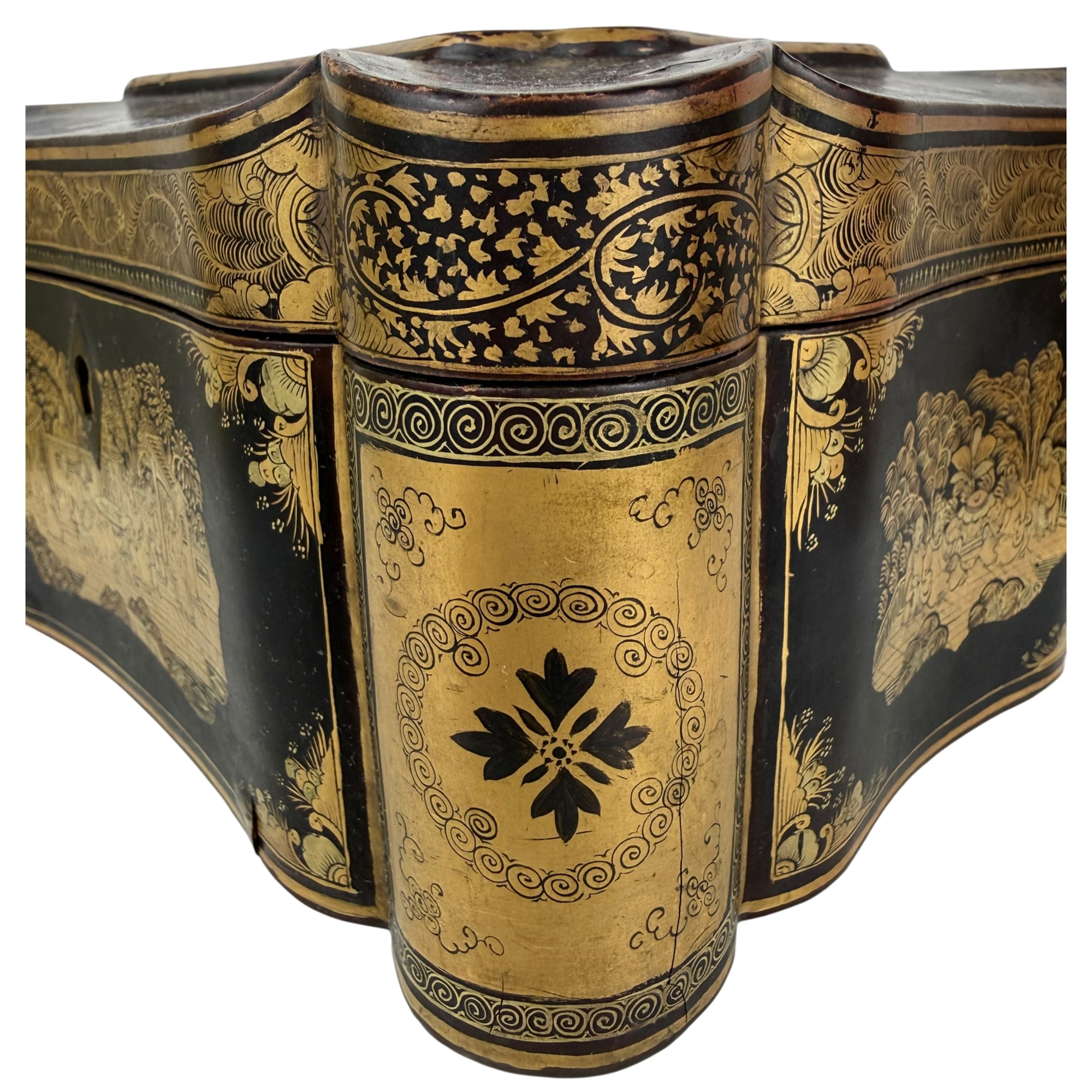 close up of gilt column on antique tea caddy