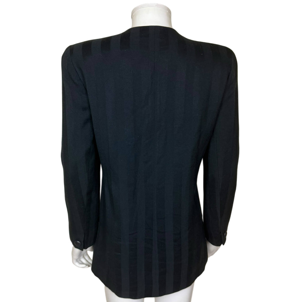 Back of vintage Christian Dior The Suit wool blazer showing structured shoulders, fitted tailoring and long rounded hem