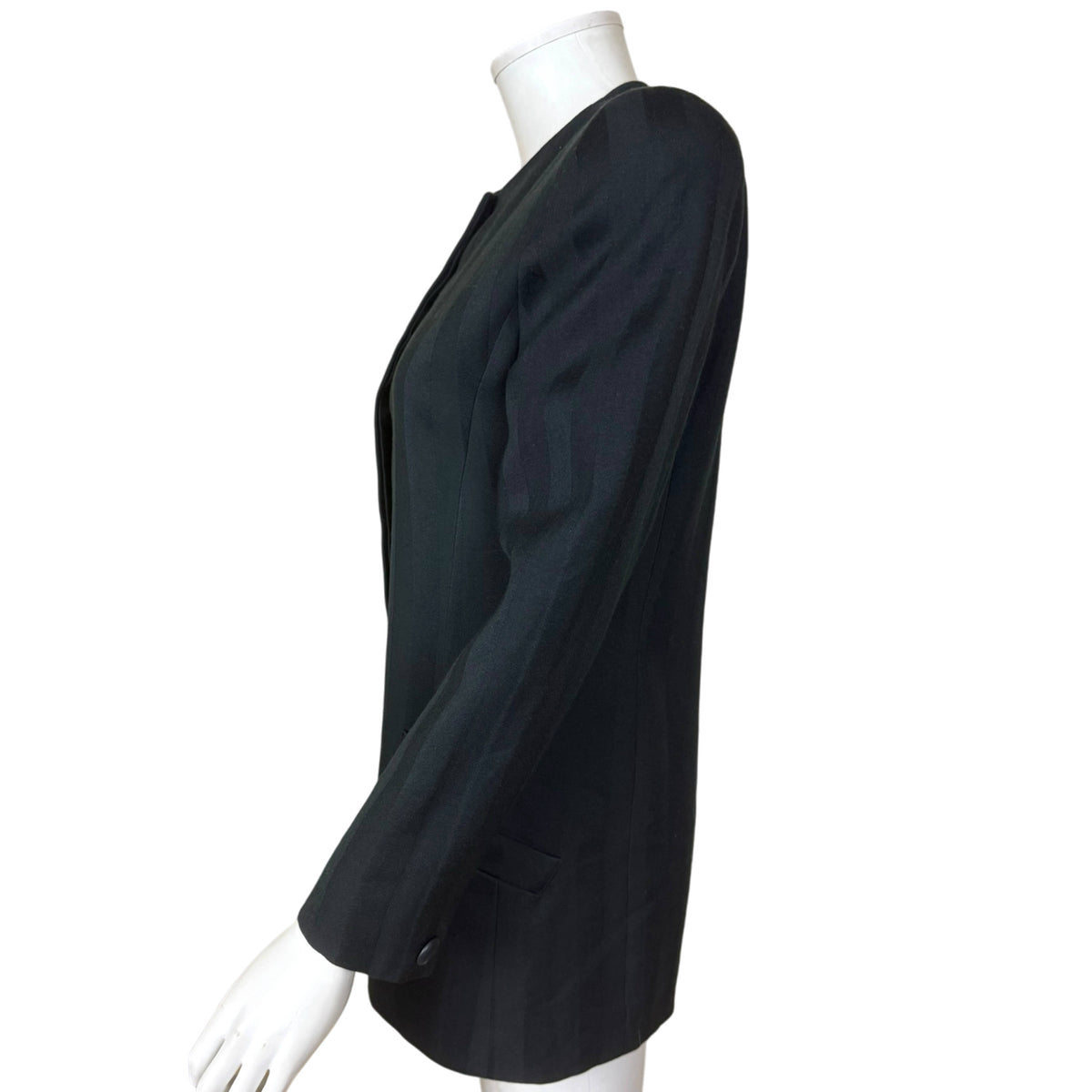 Side profile of Christian Dior shadow stripe jacket showing padded shoulder, long sleeve and elongated tailored silhouette