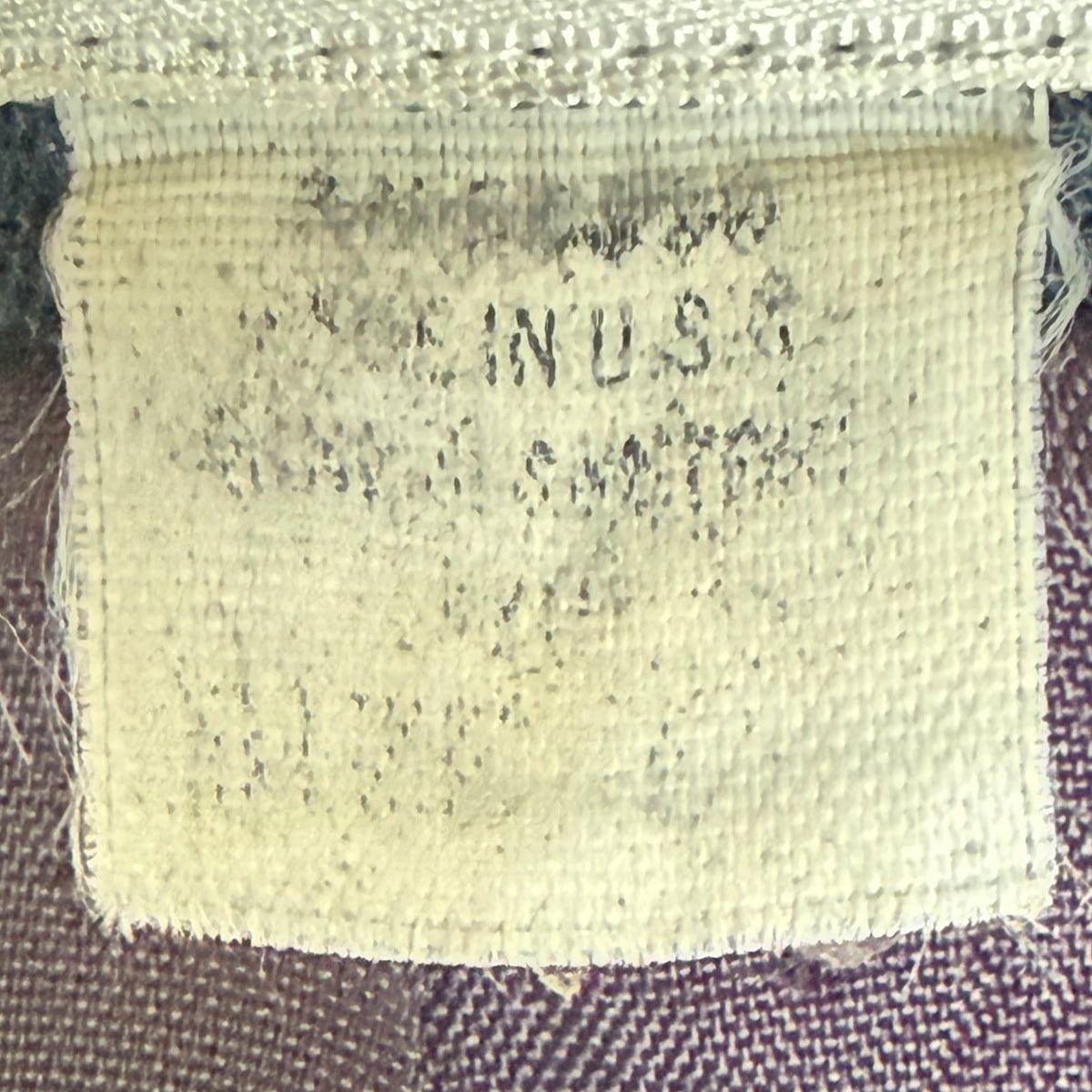 Faded Made in USA and fabric-content label inside Christian Dior worsted wool jacket