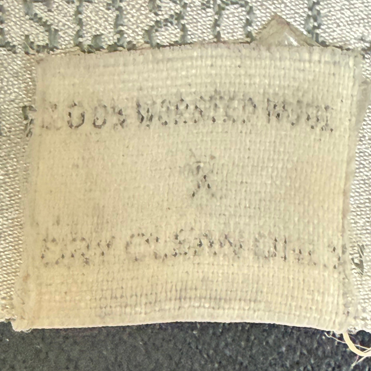 Reverse of original worn care and garment information label inside vintage Christian Dior blazer