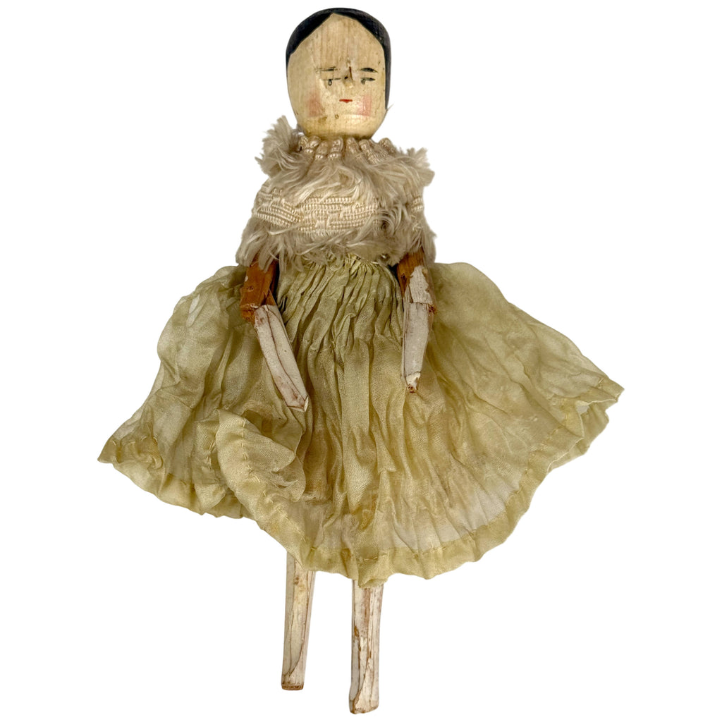 Antique German Grödnertal wooden peg doll in faded green silk chiffon dress with fringed silk passementerie, 7.5 inches tall