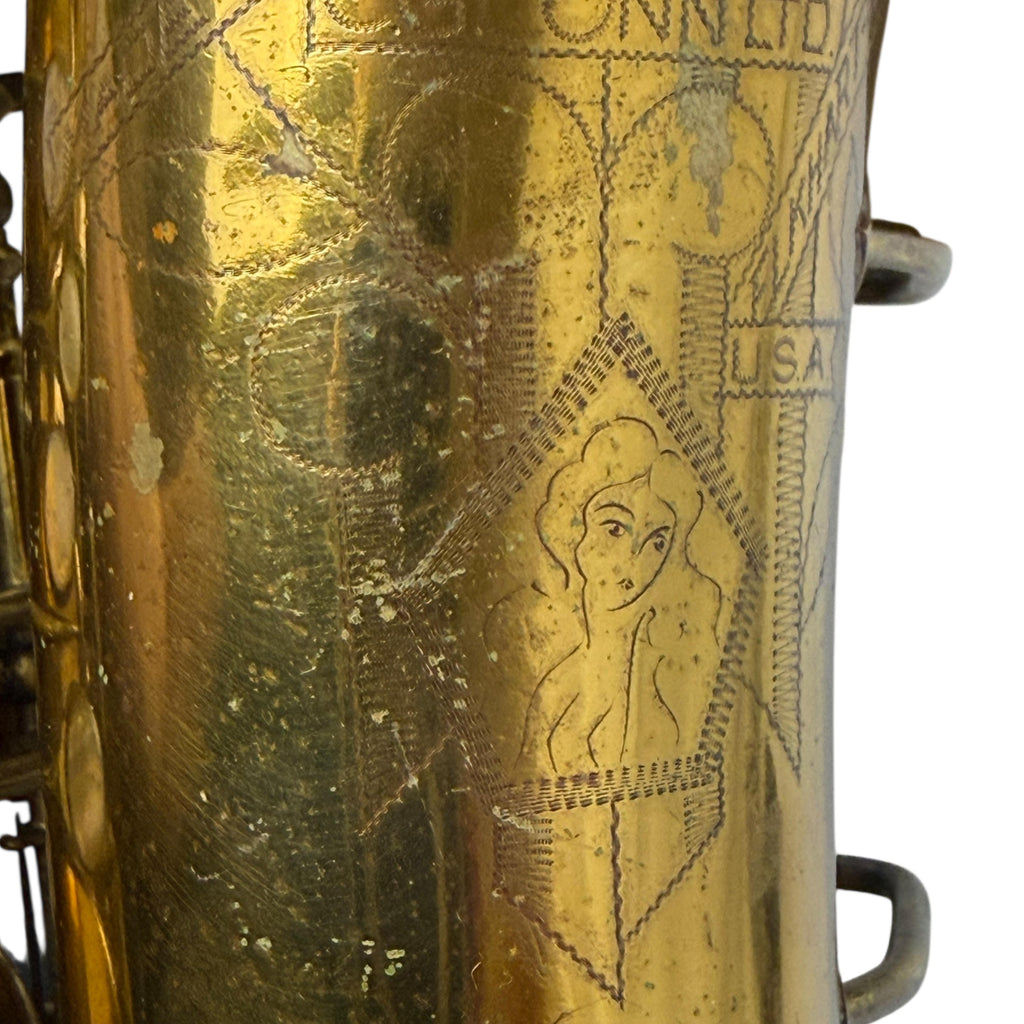 Engaving of Naked Lady on Conn 6M Sax