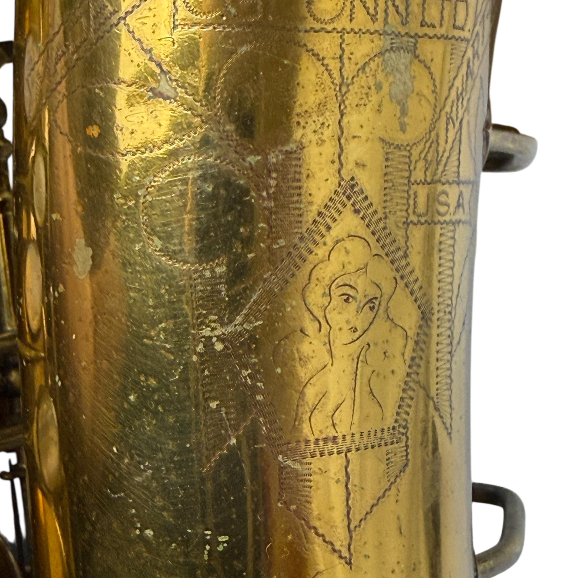 Engaving of Naked Lady on Conn 6M Sax