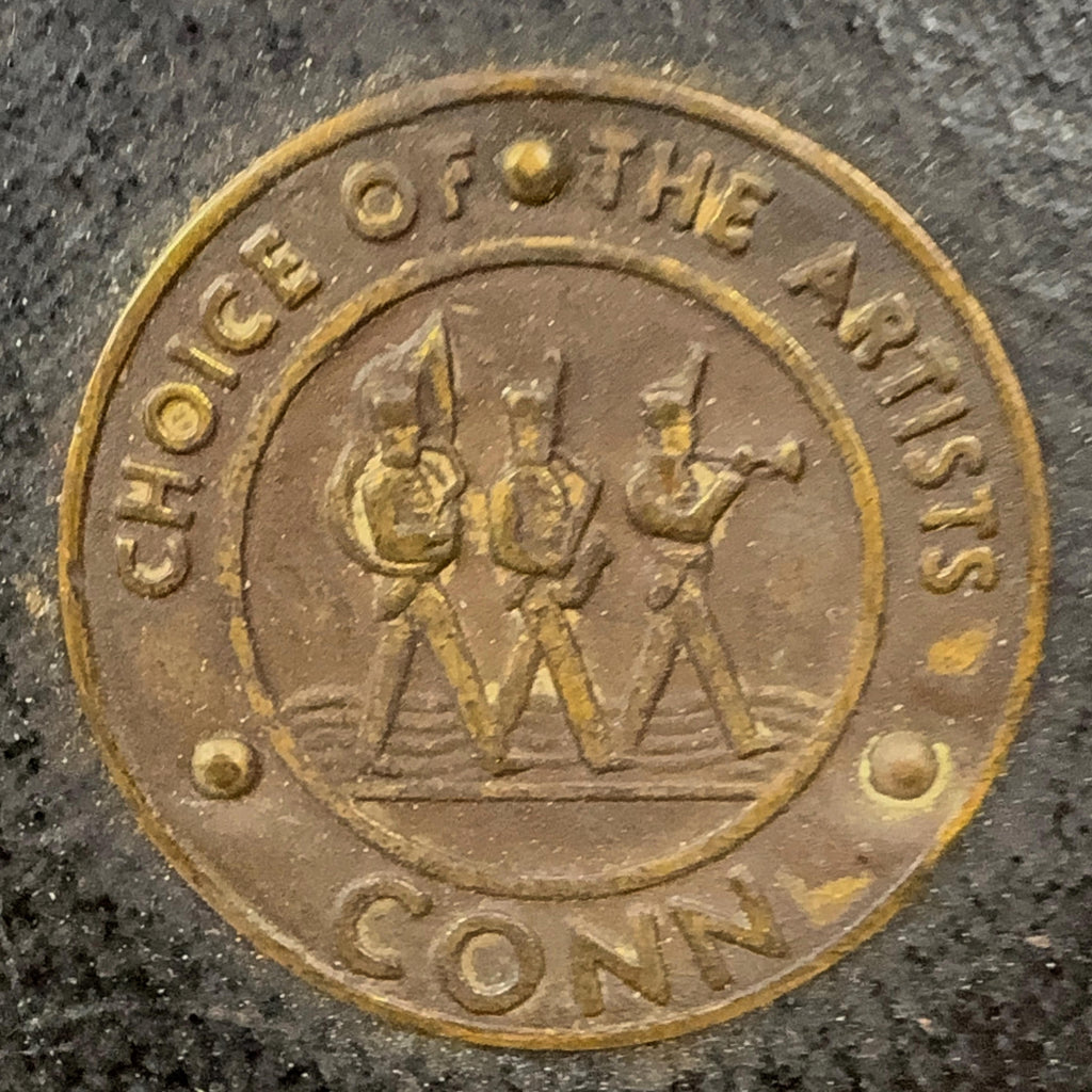 Medallion on Conn sax case