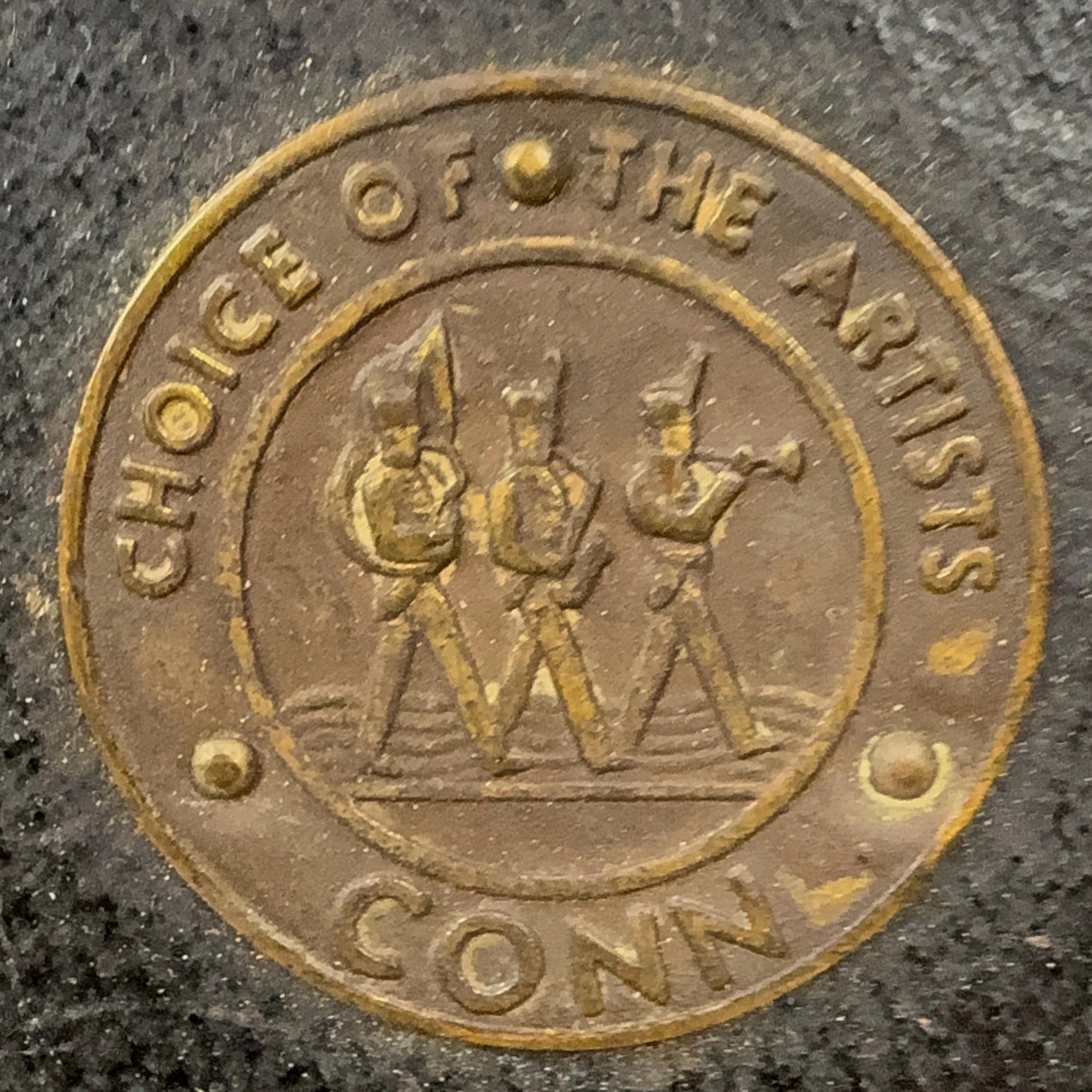 Medallion on Conn sax case