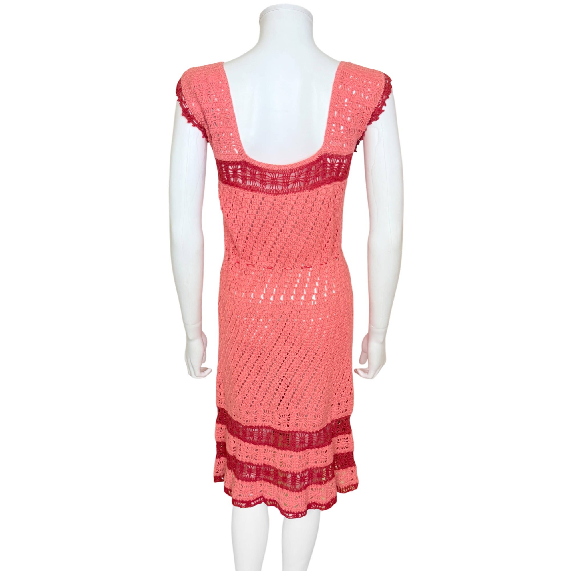 Rear view of handmade coral boho crochet dress